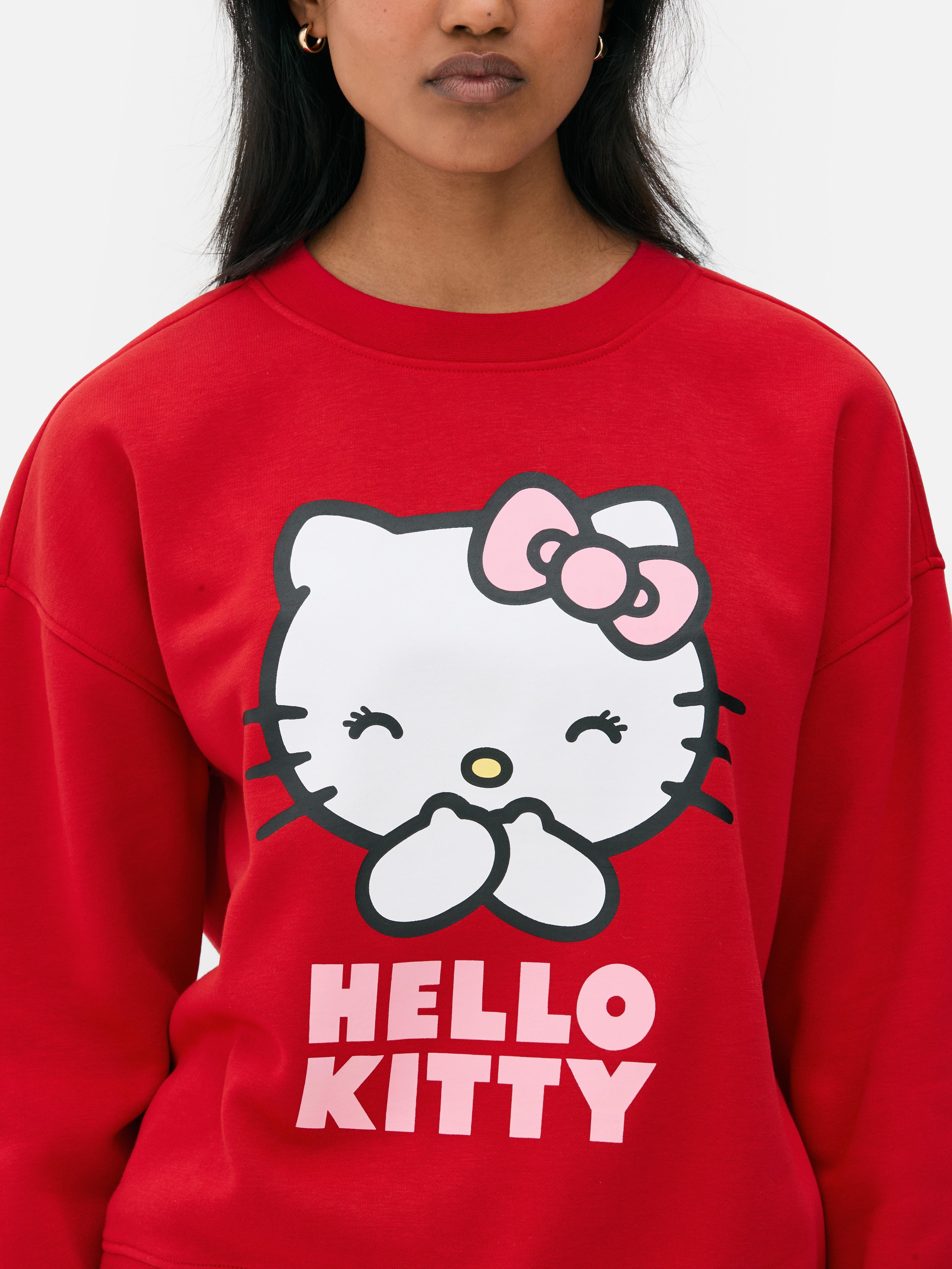 Φούτερ με στάμπα Hello Kitty. Ένα πολύχρωμο φούτερ Hello Kitty με στρογγυλή λαιμόκοψη και μακριά μανίκια.