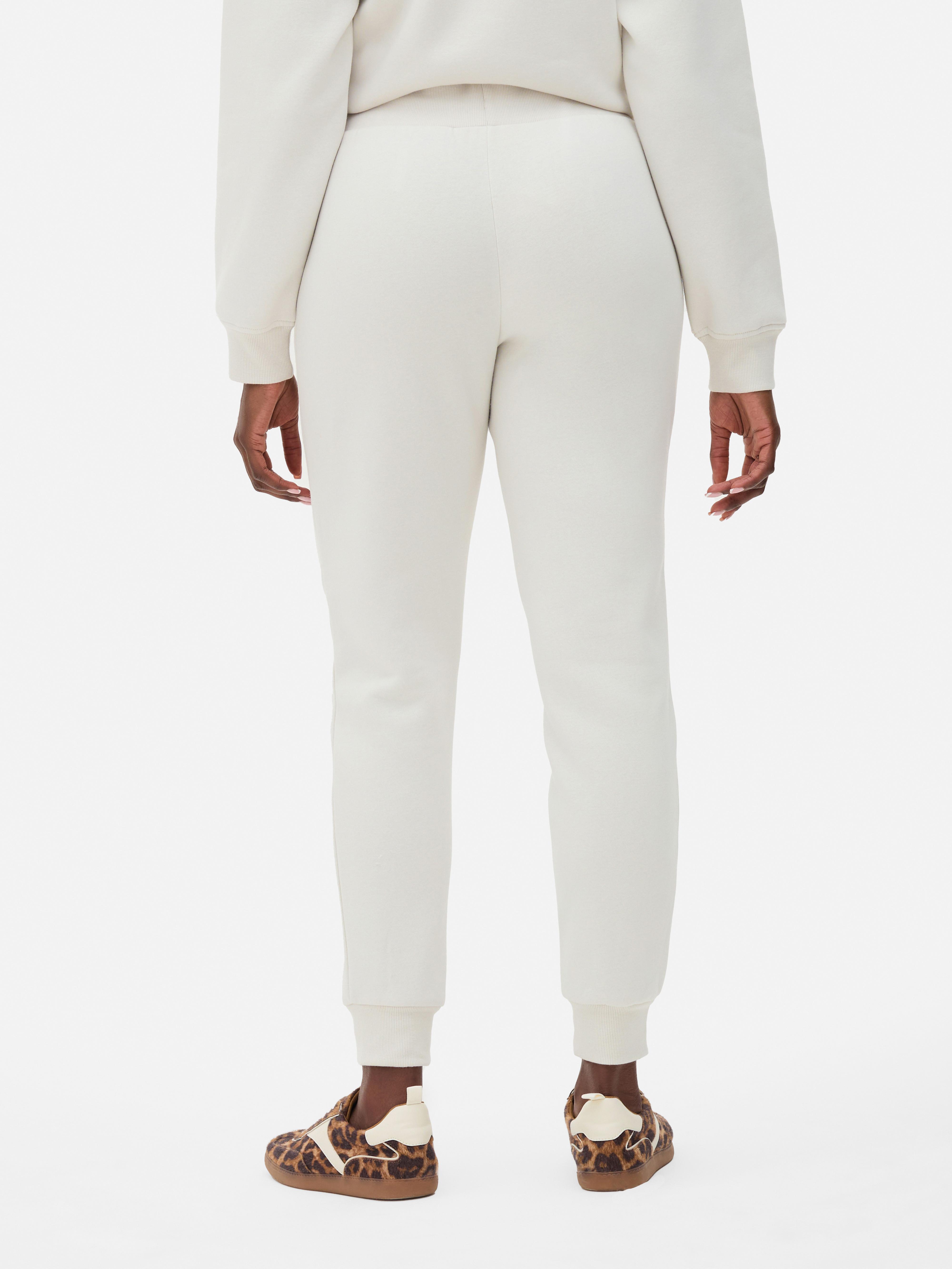 Pantaloni de trening skinny Acești pantaloni de trening slim fit cu manșete la gleznă creează un aspect elegant pentru momente elegante și zile active.