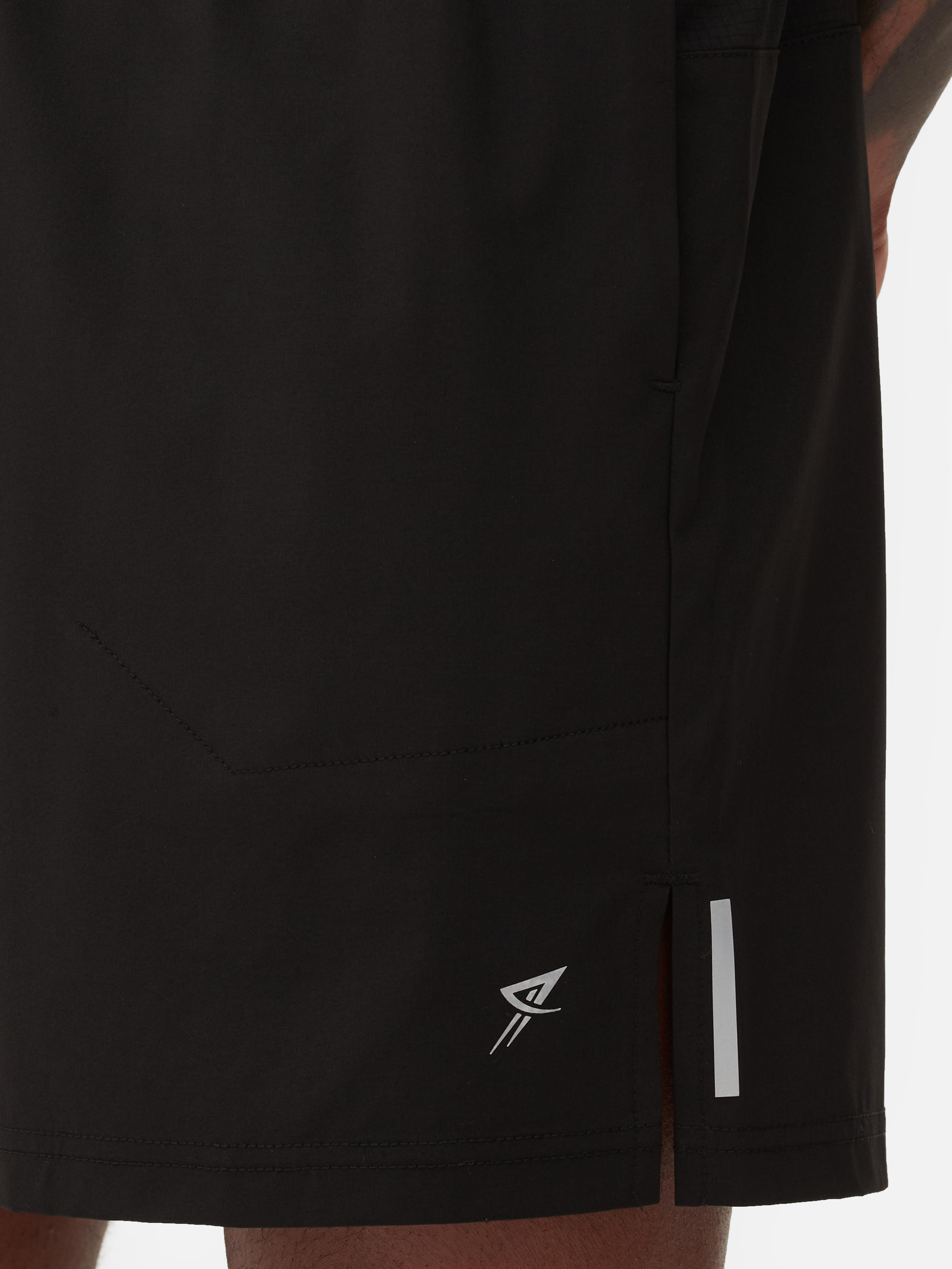 Pantaloni scurți de alergare cu talie elastică Pantaloni scurți sport de alergare cu talie elastică și buzunare multiple