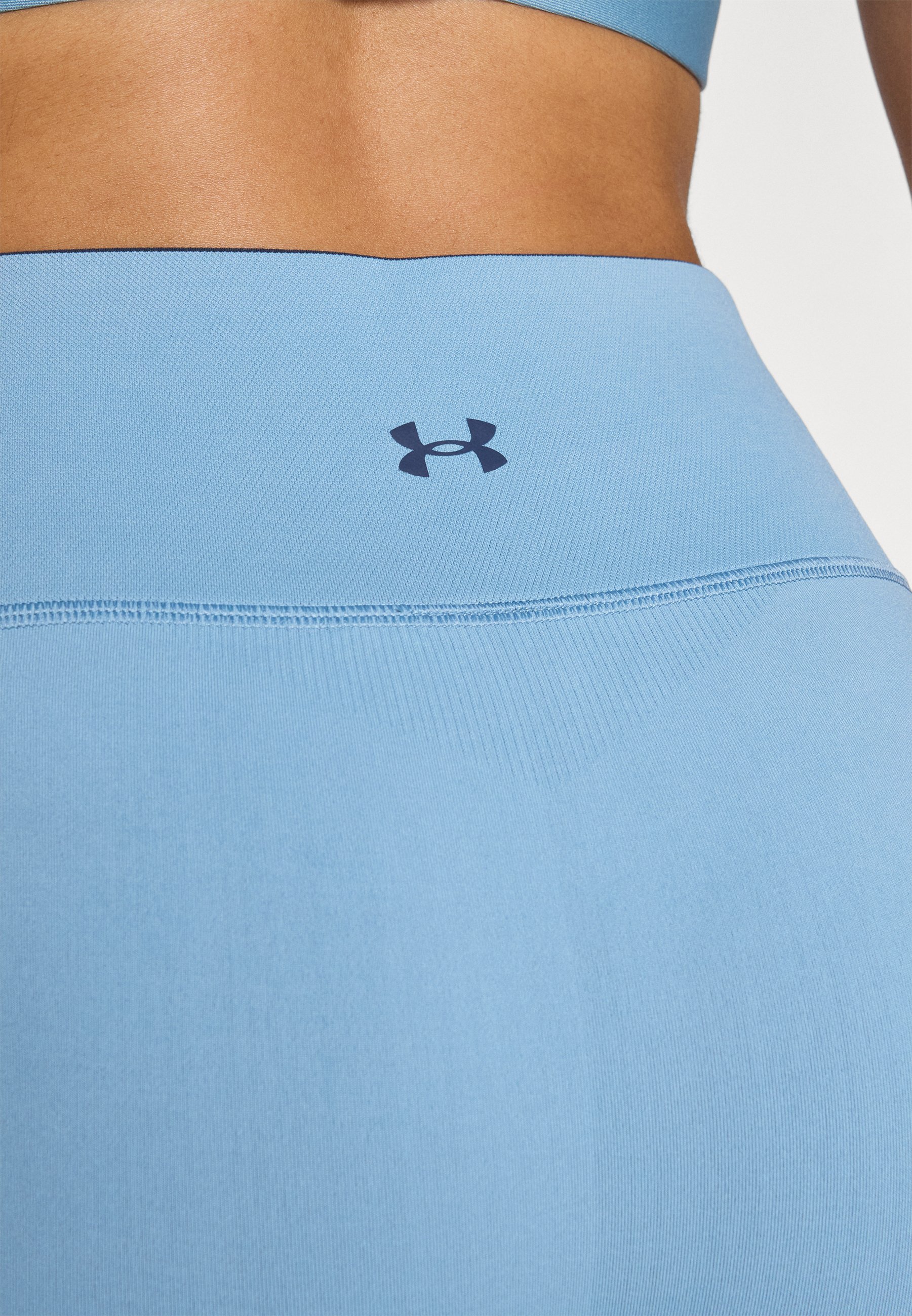 Leginsy VANISH SEAMLESS marki Under Armour – niebieskie przydymione/sprany granat