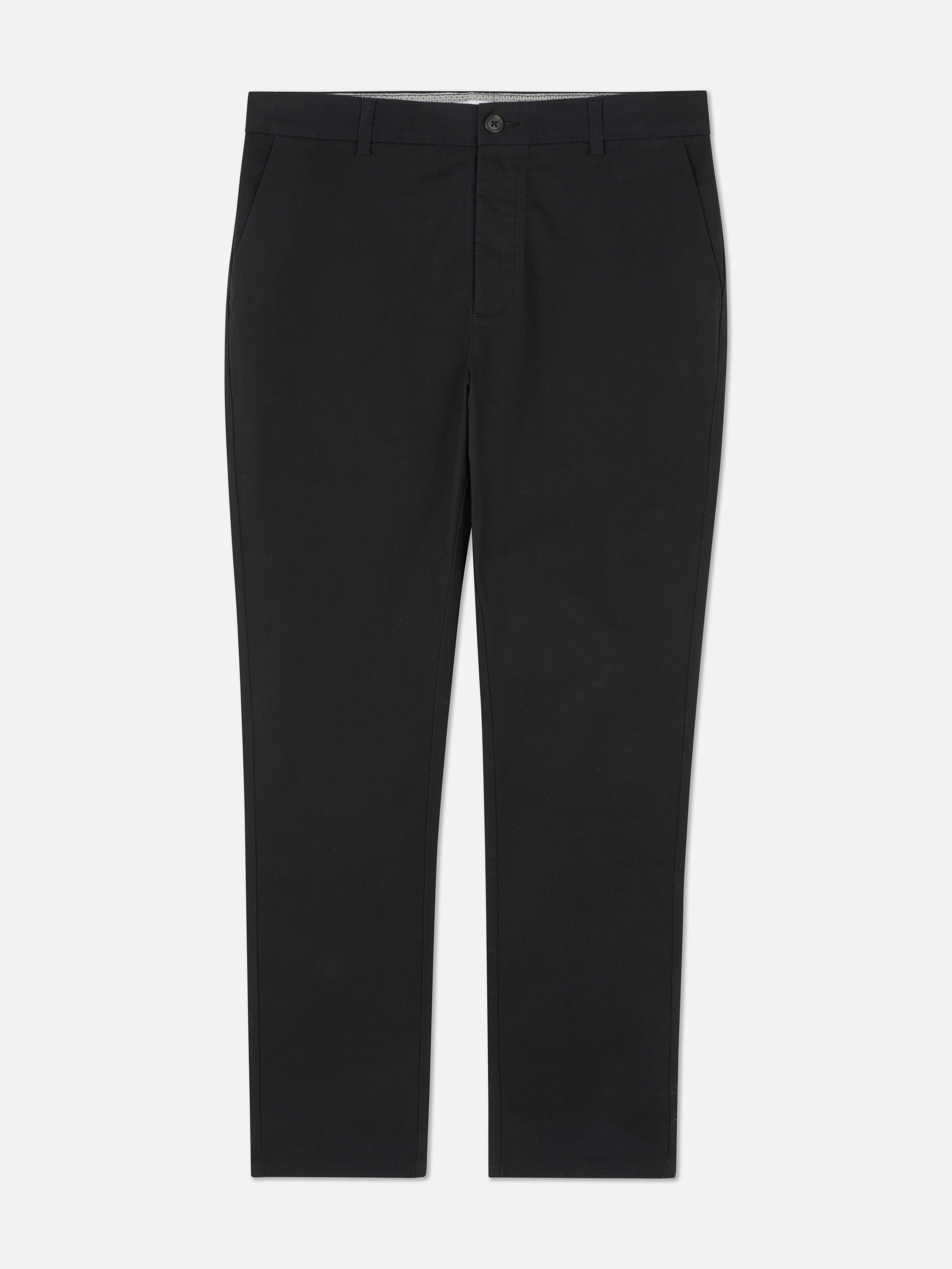 Pantaloni chino elastici, mulați. Pantaloni chino mulați, confecționați în principal din bumbac și cu buzunare laterale.
