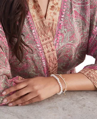 Pulsera con colgante de cuentas de la Casa de los Rituales