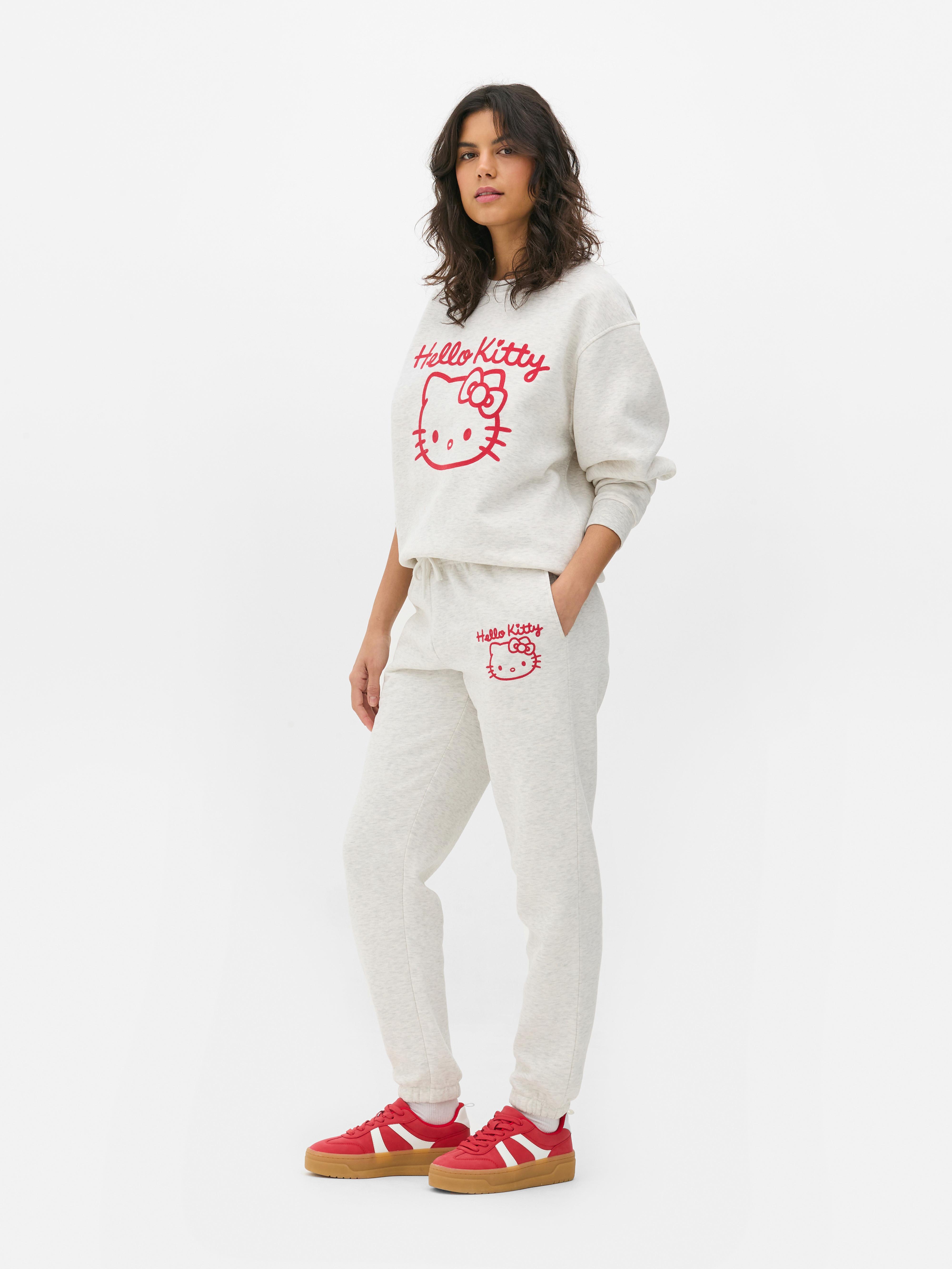 Pantaloni de jogging cu imprimeu Hello Kitty. Un pantalon de jogging Hello Kitty cu șnur în talie și manșete la gleznă.