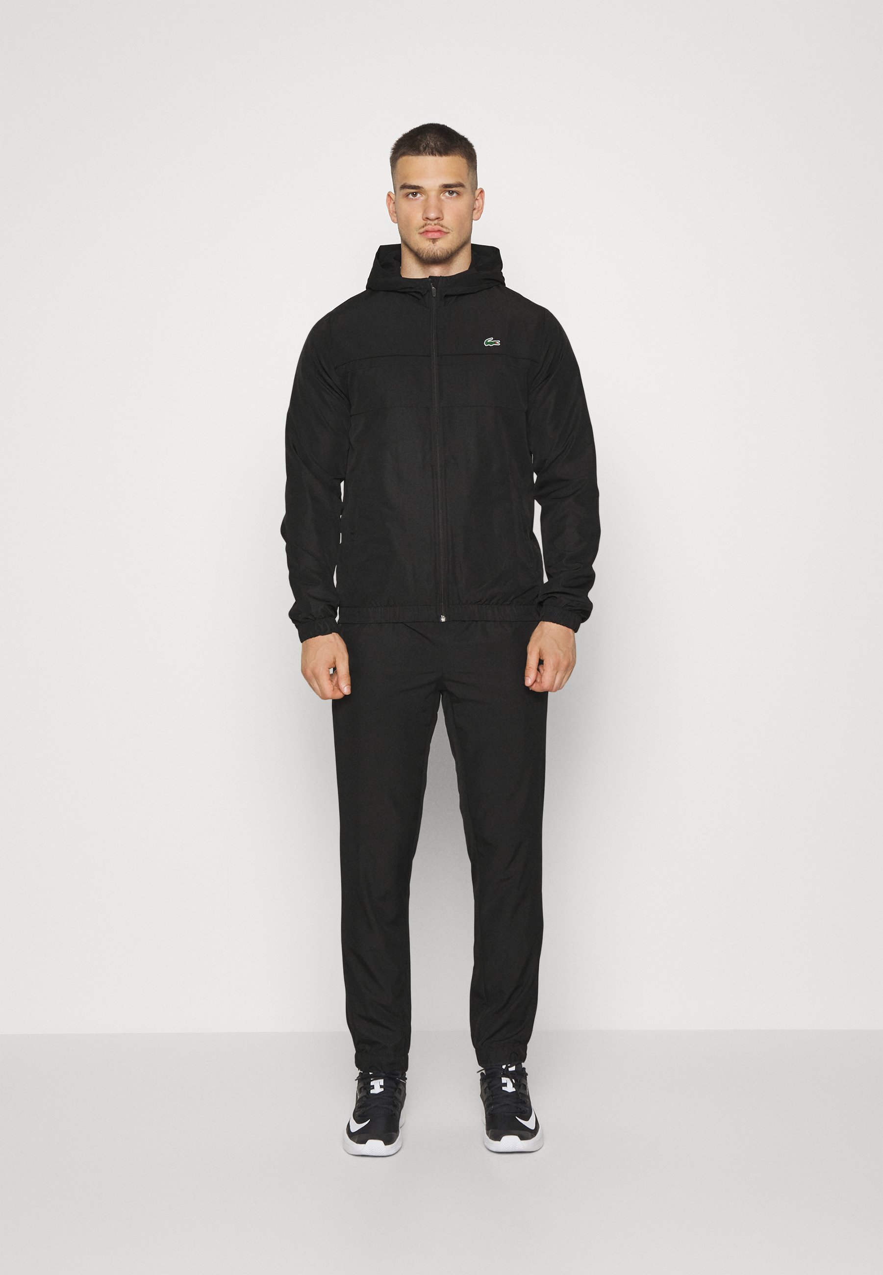 Tuta sportiva Lacoste con cappuccio - nera