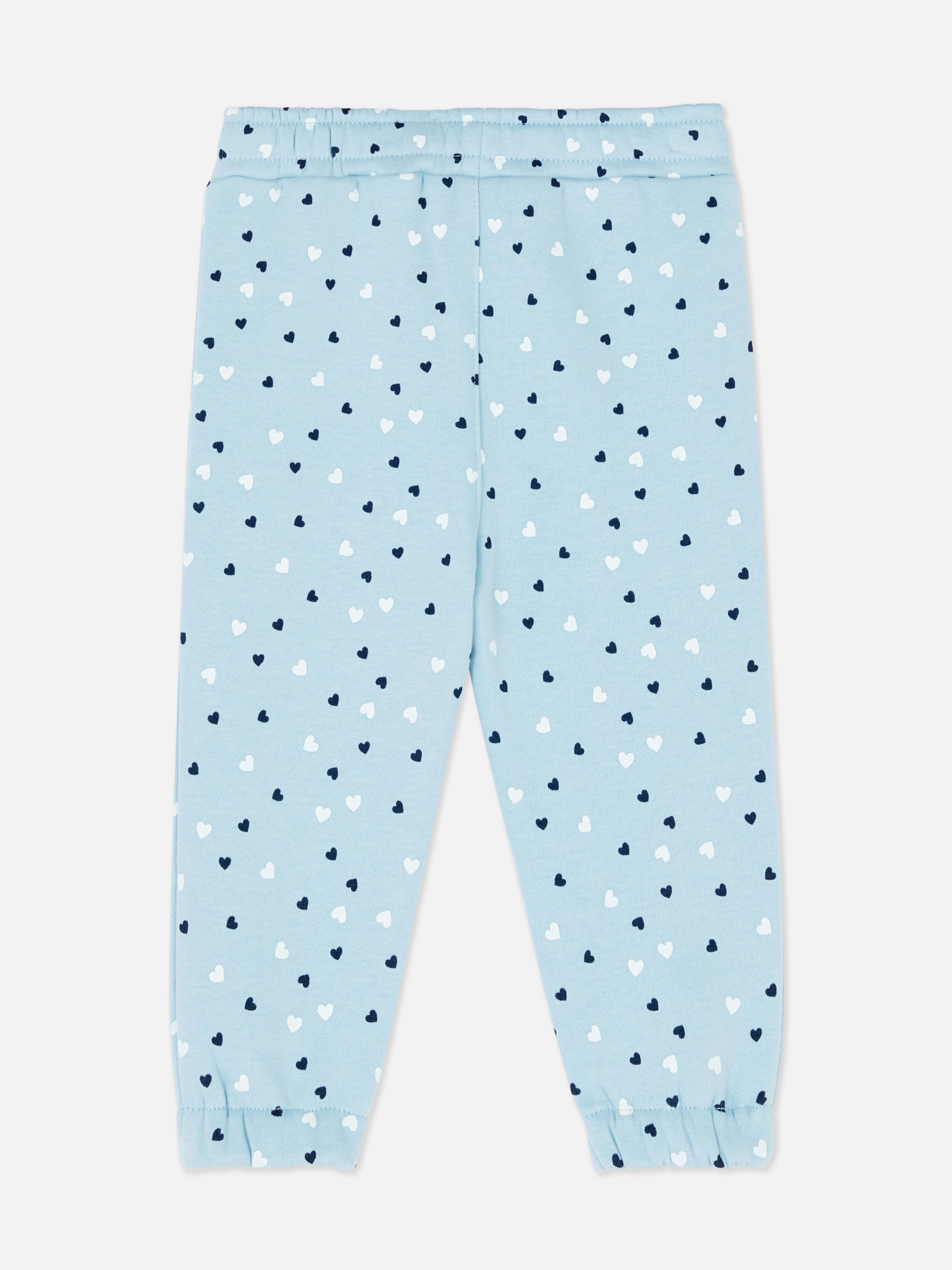 Pantaloni de trening asortați cu talie elastică și șnur de strângere. Acești pantaloni de trening drăguți au manșete la gleznă și sunt extrem de confortabili.