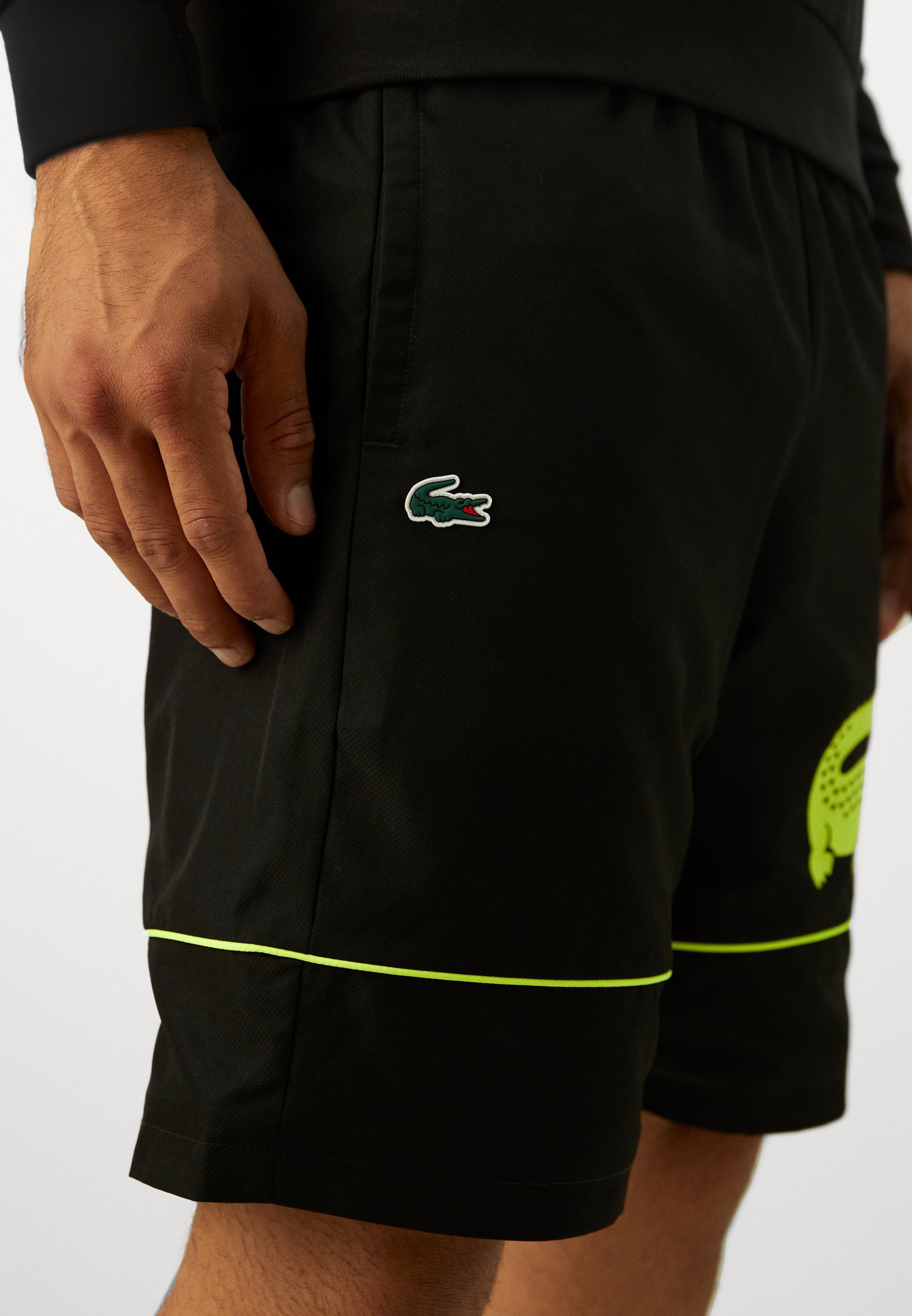 Pantaloncini sportivi Lacoste Sport - nero/giallo fluo