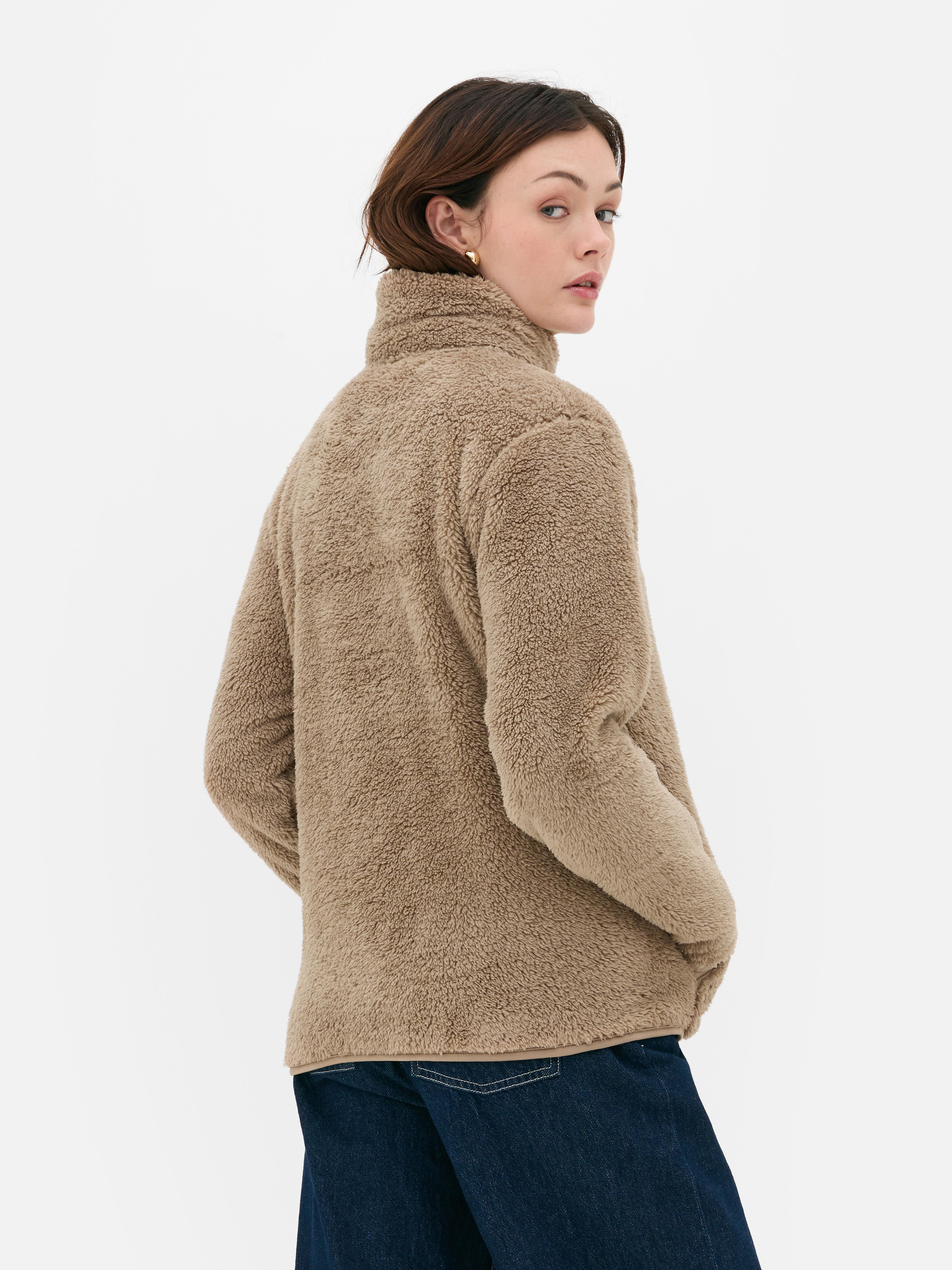 Teddy fleece zippered jacket. A soft teddy fleece jacket with long sleeves, a stand-up collar, and a full-length zipper.