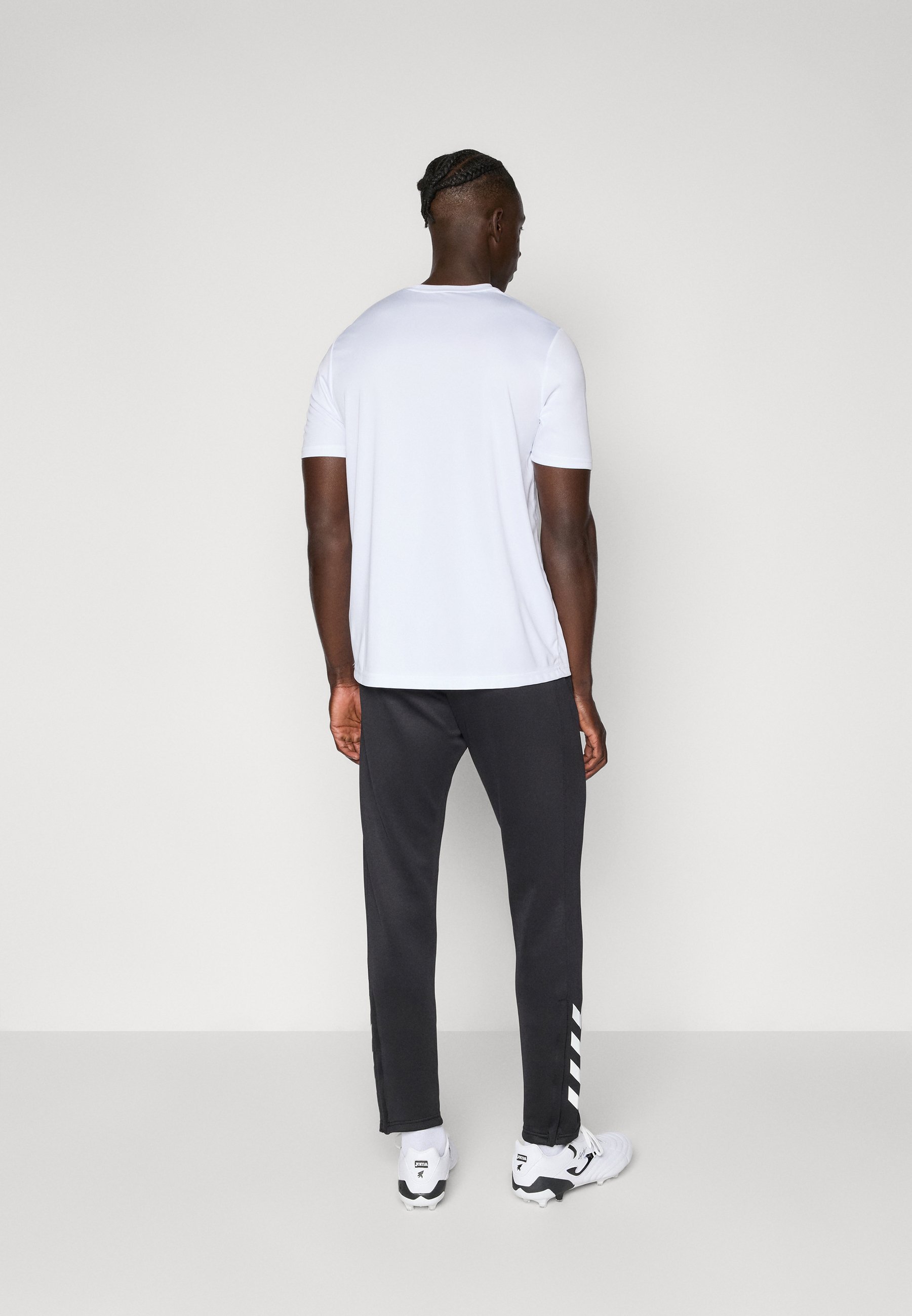 Hummel HMLCORE PANTS - Trainingshose - schwarz