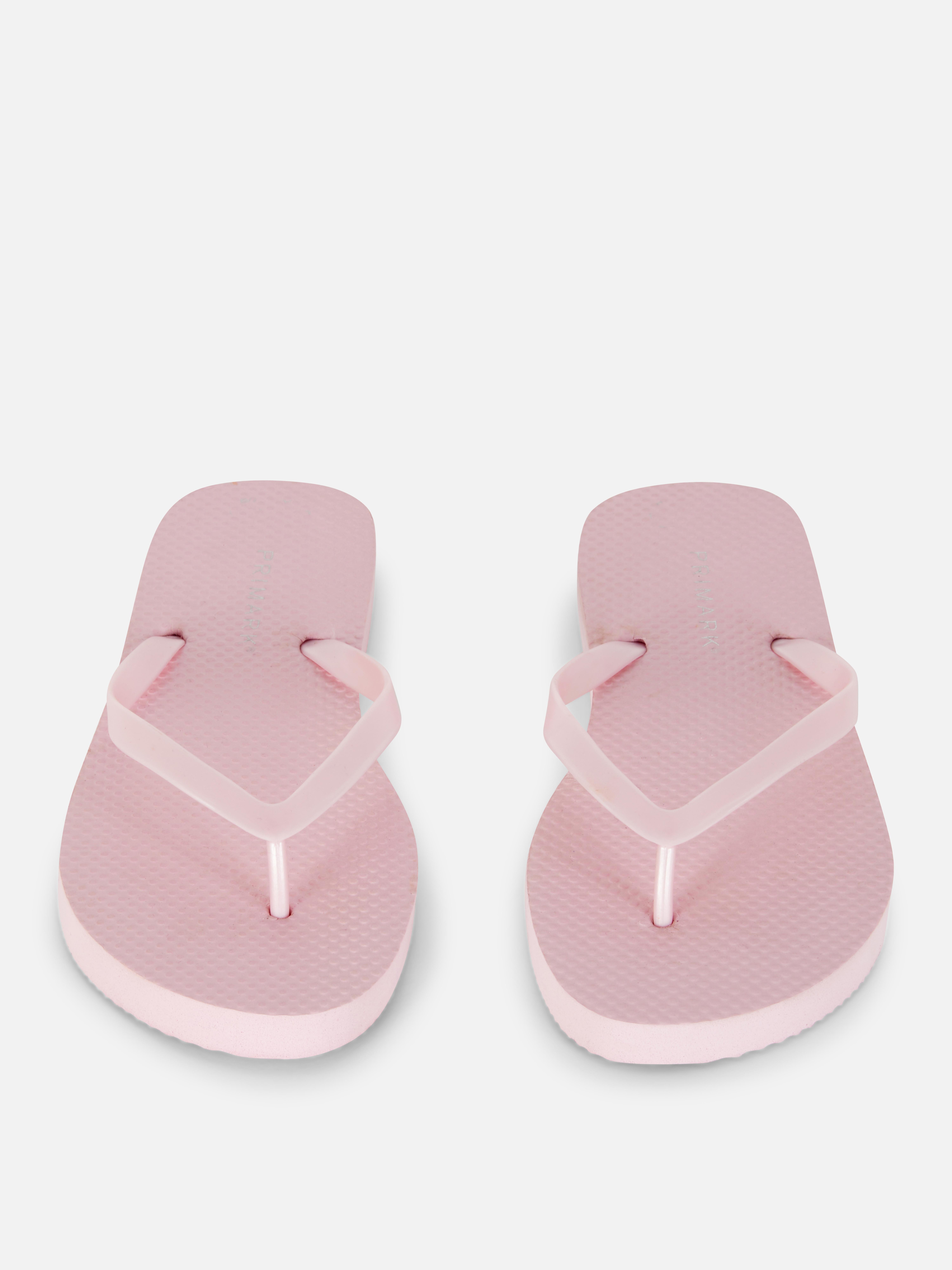 Flip-flops clasici O pereche de flip-flops simpli cu barete înguste și talpă plată