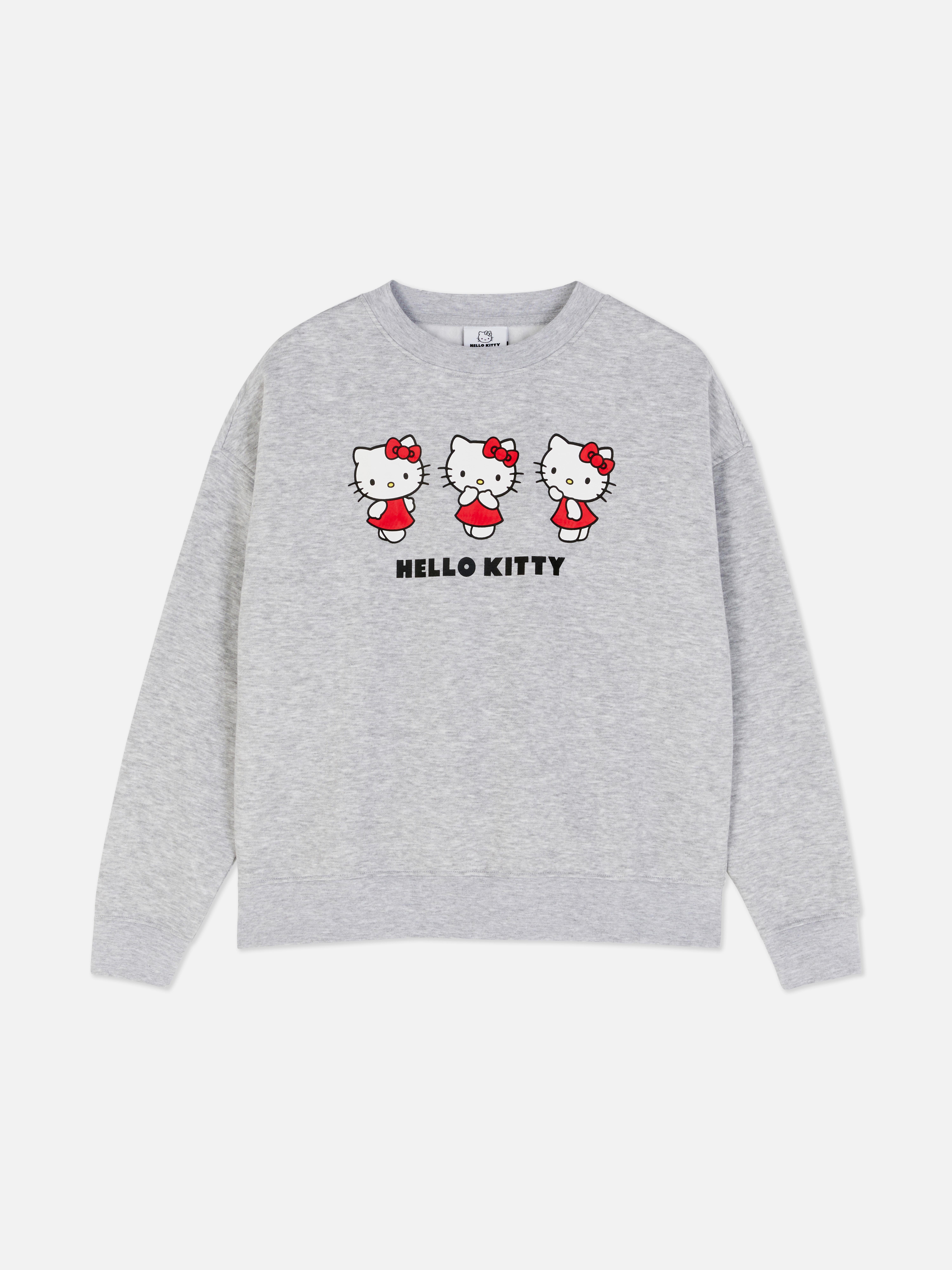 Дуксерица са принтом Hello Kitty Дуксерица широког кроја са округлим изрезом, спуштеним раменима и принтом Hello Kitty