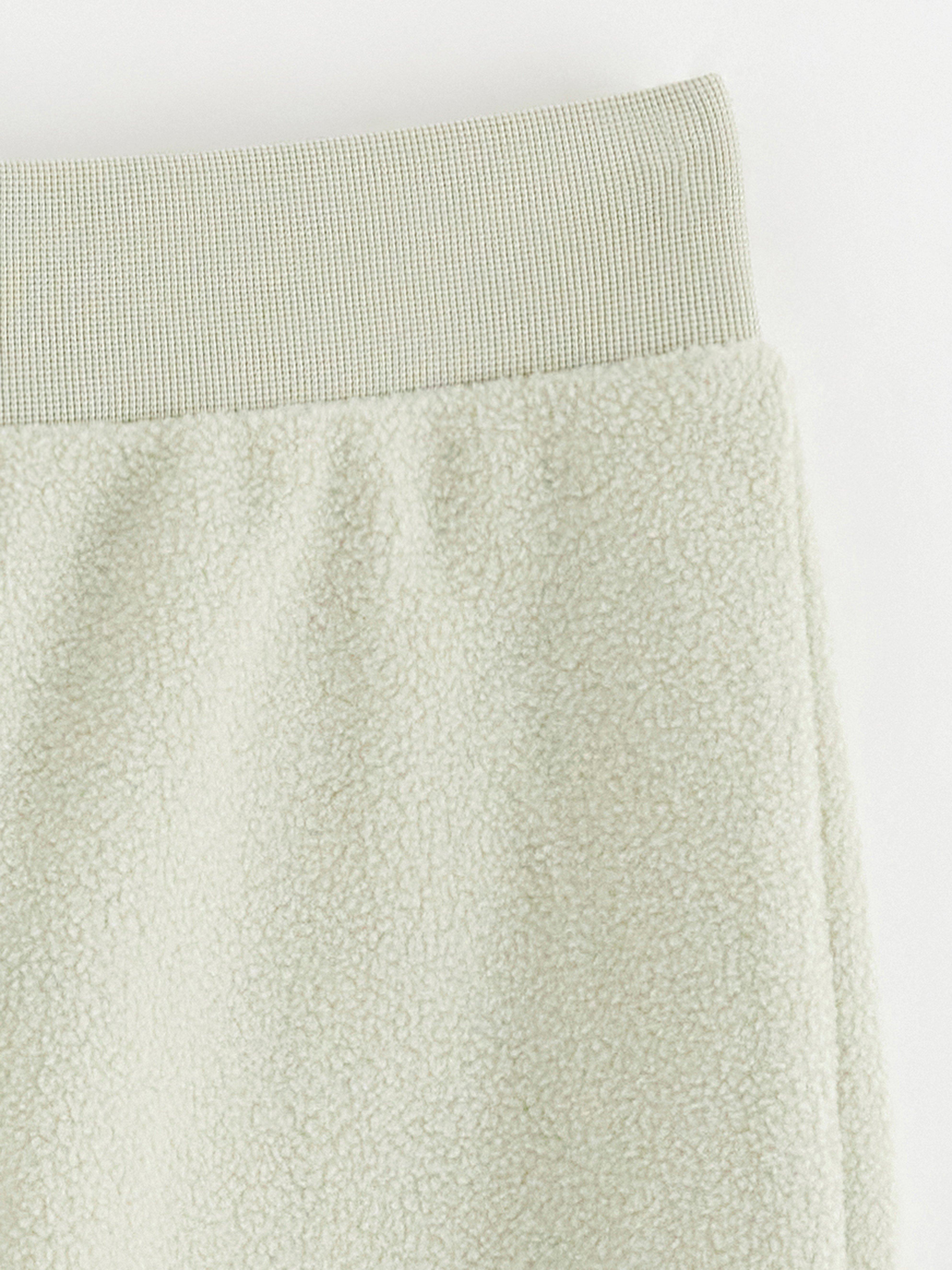 Calça de moletom fleece verde claro acinzentado