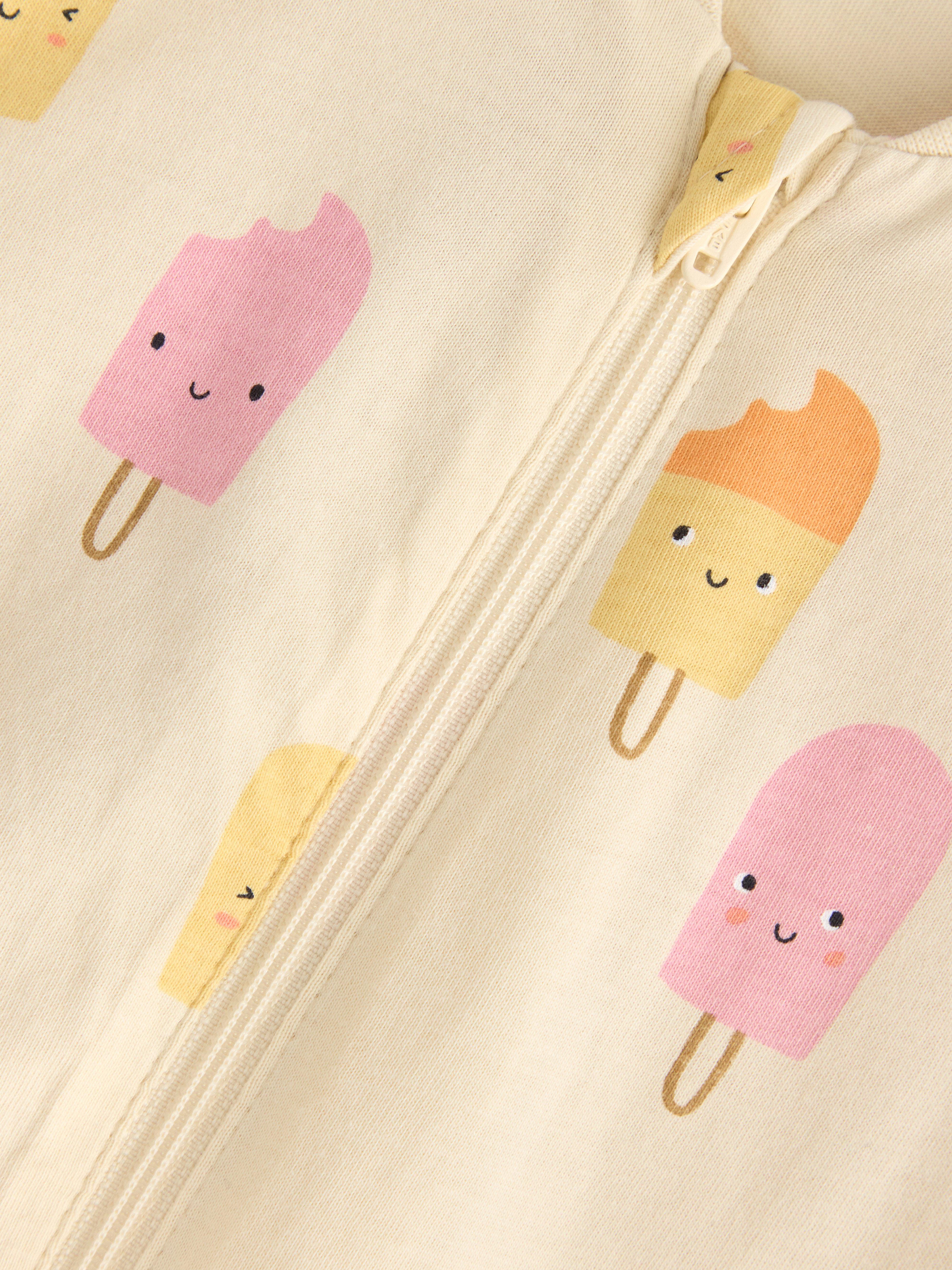 Macacão de pijama amarelo claro acinzentado