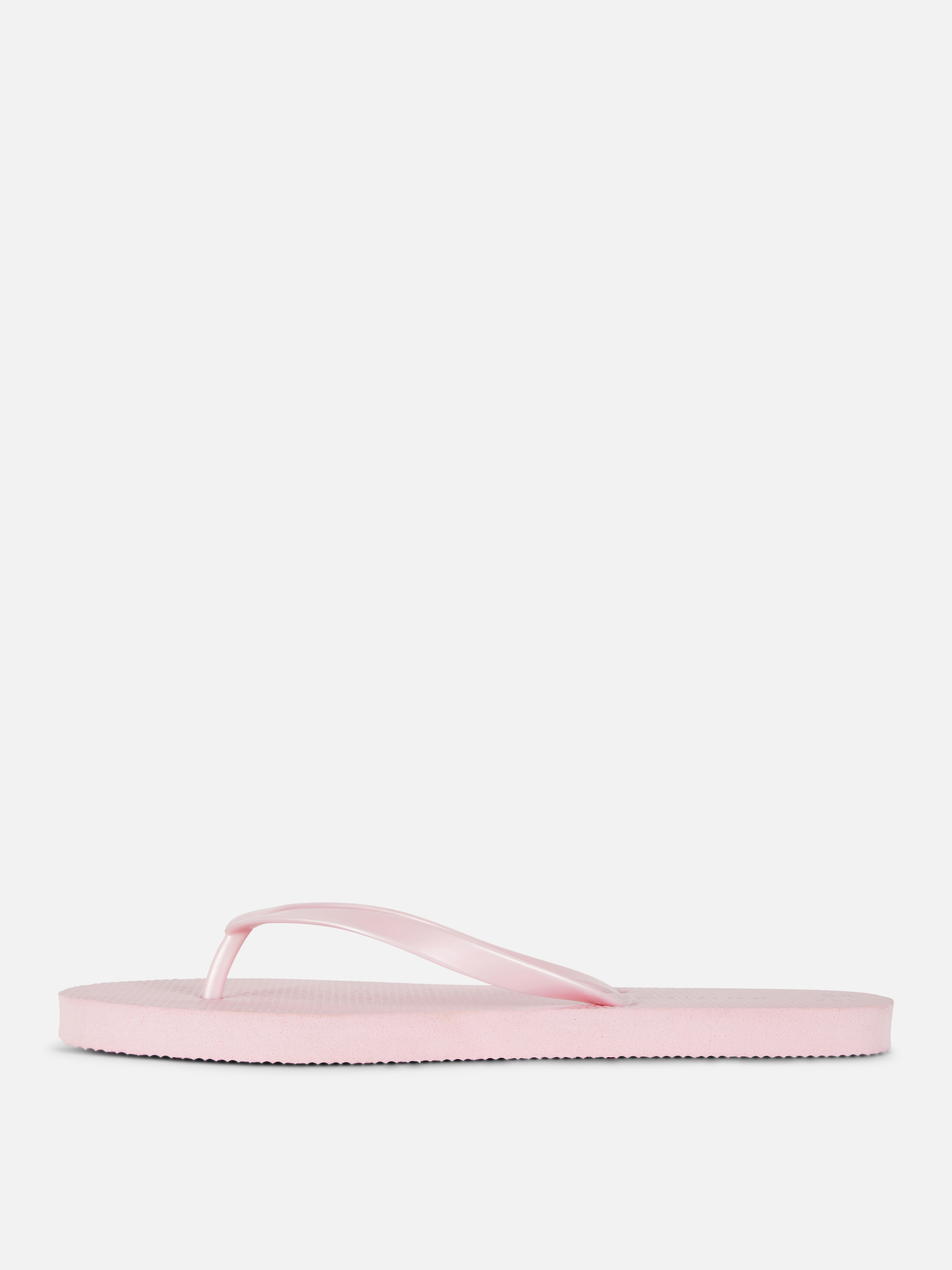 Flip-flops clasici O pereche de flip-flops simpli cu barete înguste și talpă plată