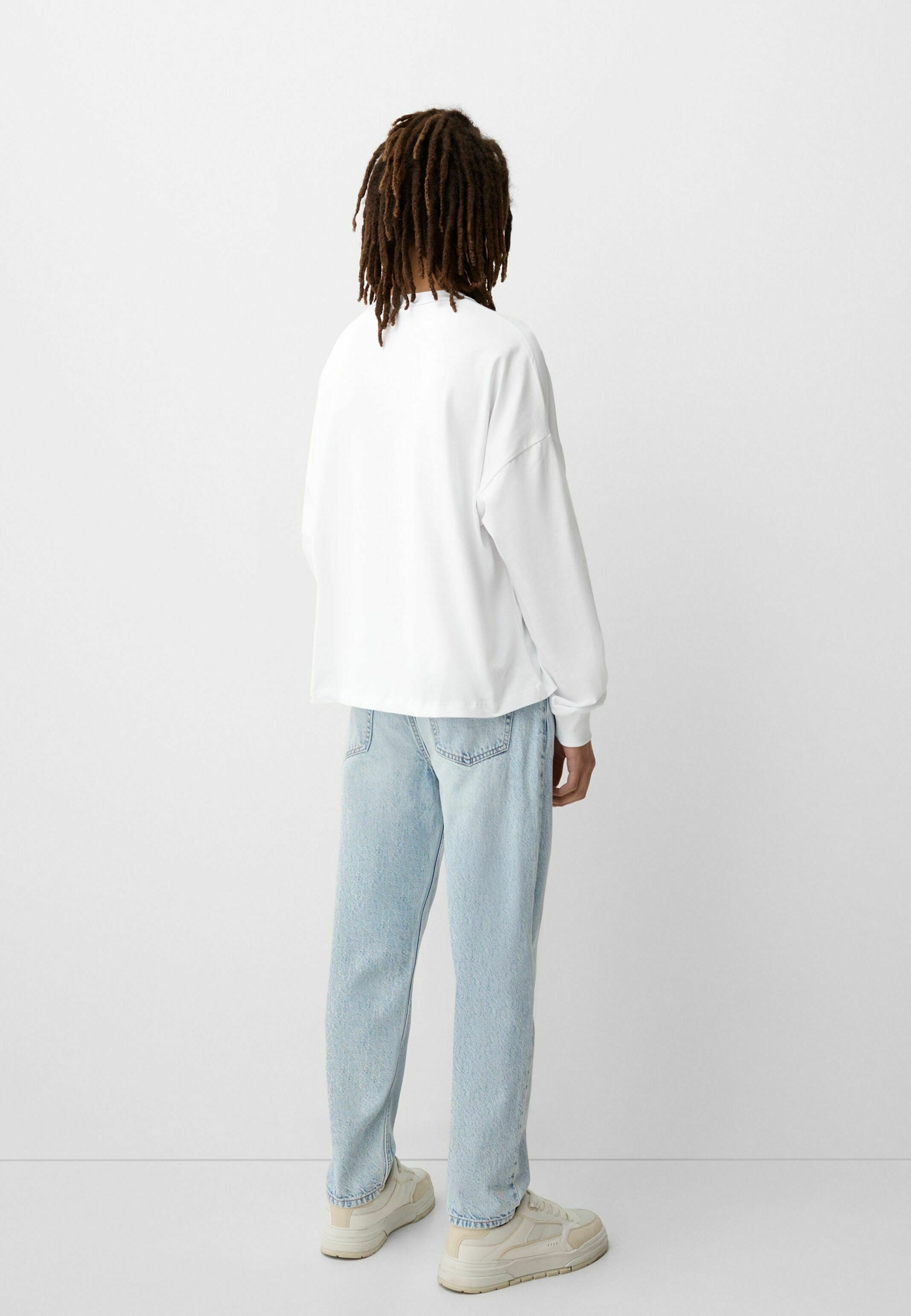 Bershka jeans met taps toelopende pasvorm - lichtblauw