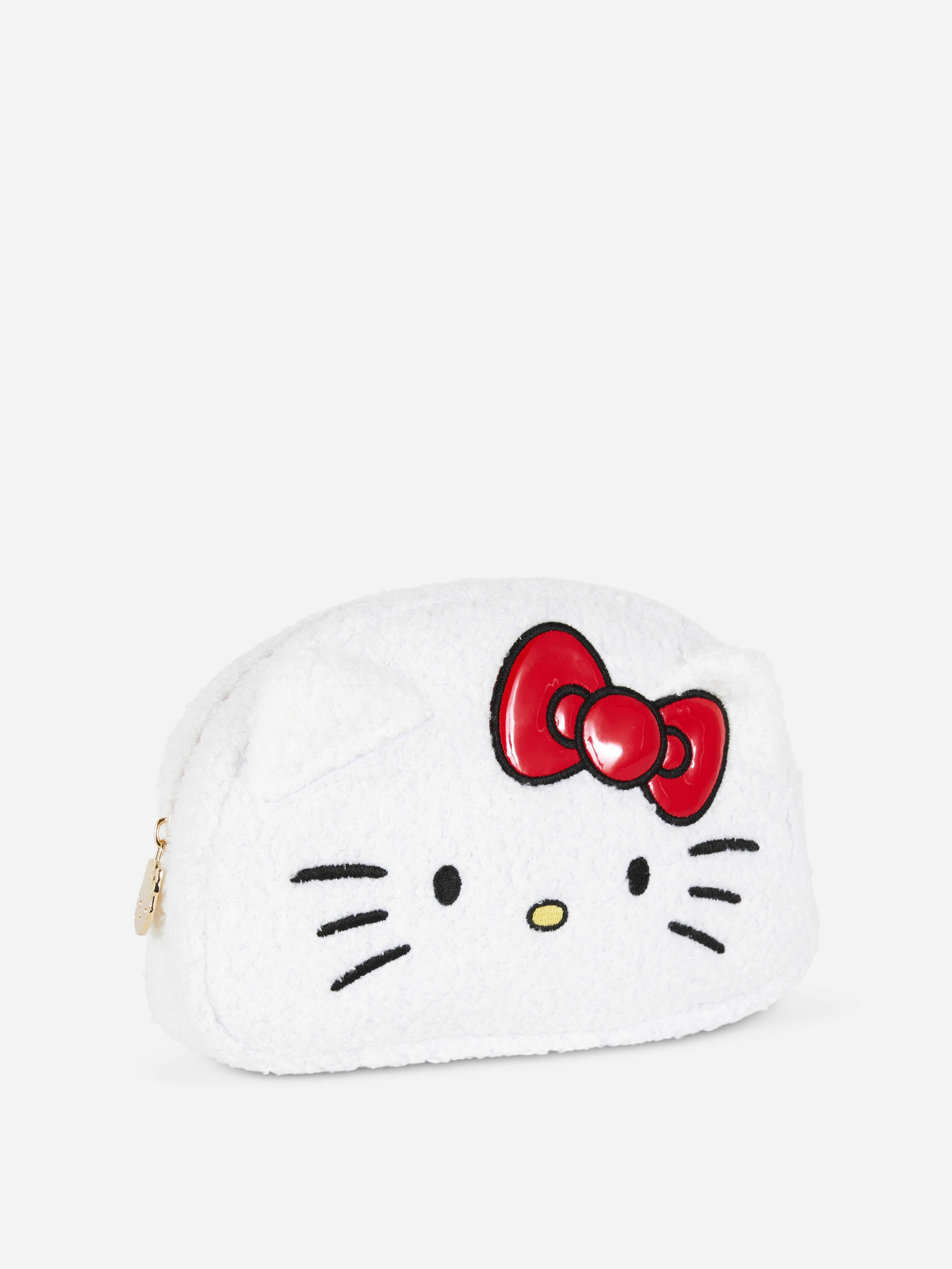 Geantă de machiaj de pluș Hello Kitty and Friends O geantă de machiaj de pluș cu fermoar metalic și design Hello Kitty cu urechi