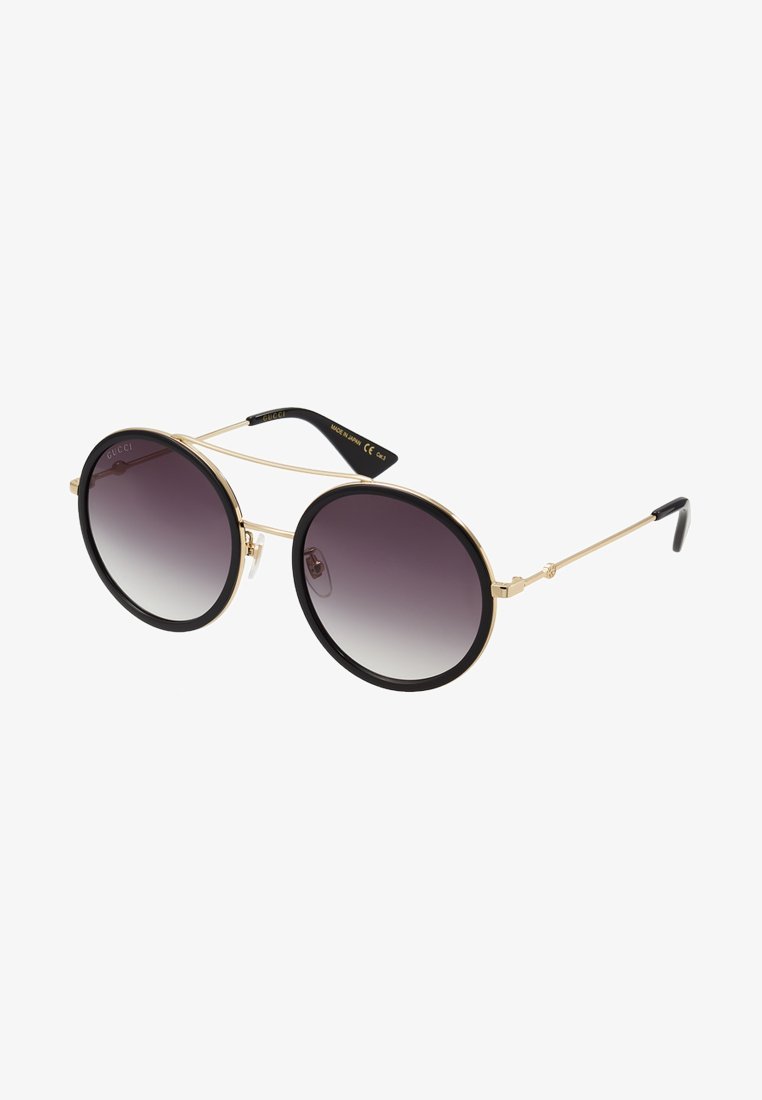 Lunettes de soleil Gucci - dorées/grises