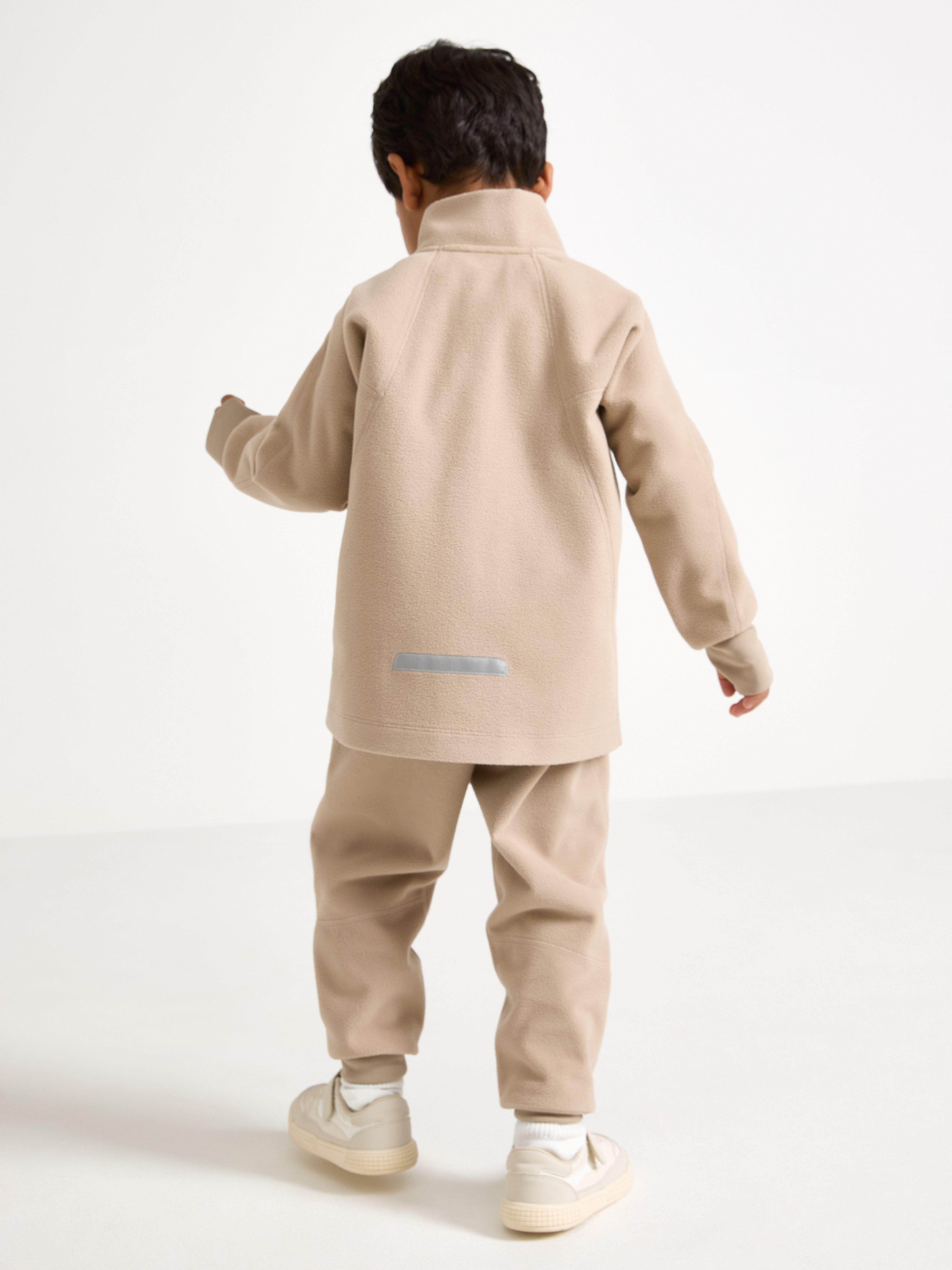 Jaqueta infantil impermeável de fleece para atividades ao vento – Bege Claro