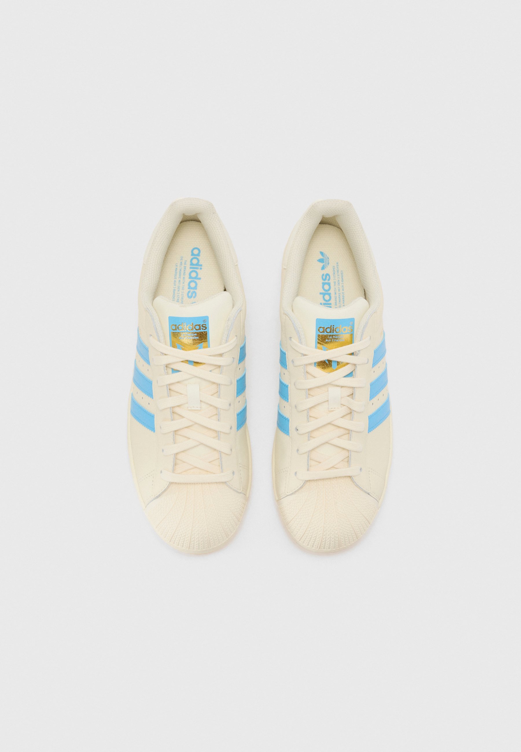 adidas Originals SUPERSTAR MESSI UNISEX - Kopačke za dvoranski nogomet - krem bijele/poluplave boje/zlatne boje