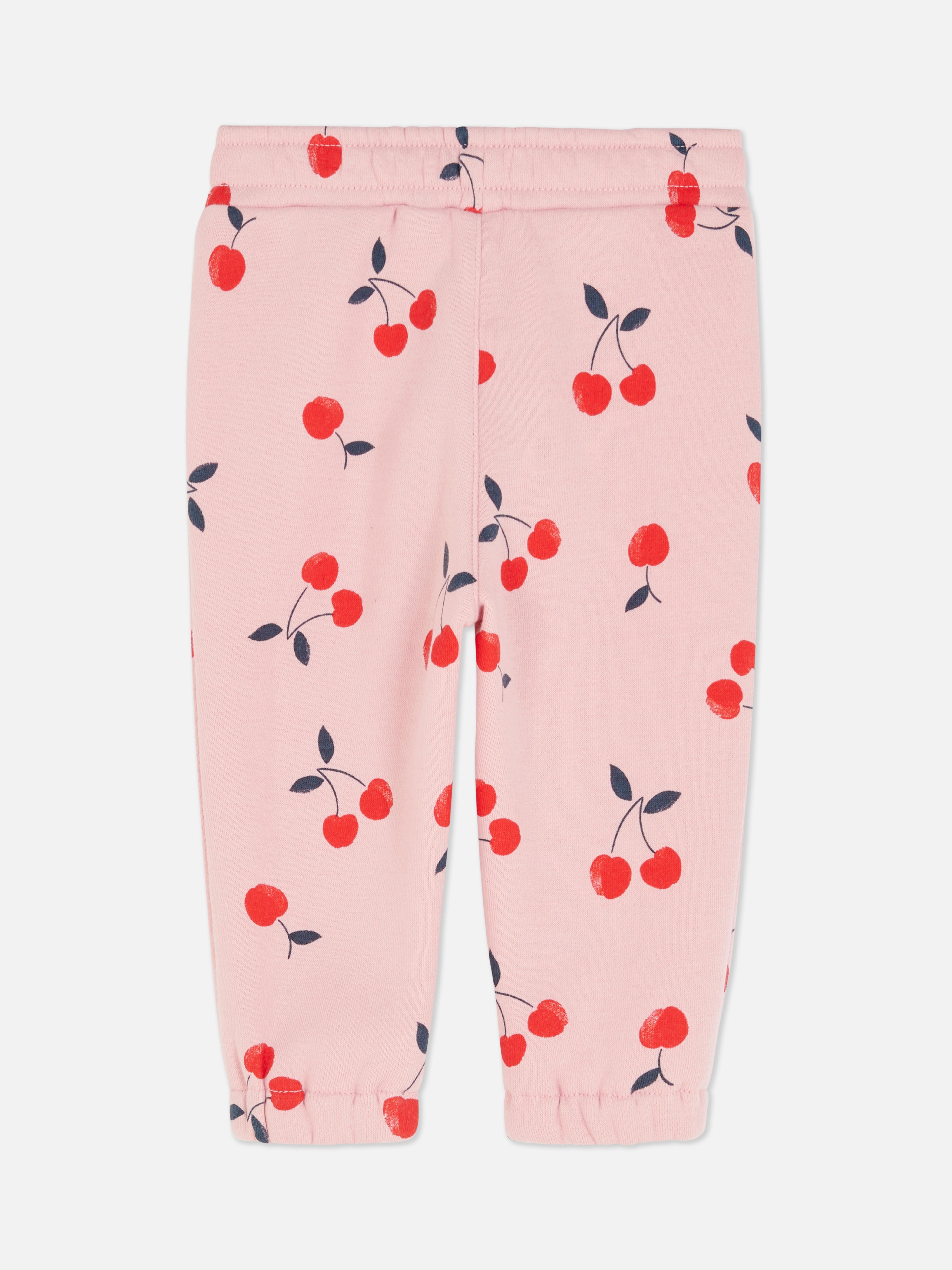 Pantaloni de trening asortați cu talie elastică și șnur de strângere. Acești pantaloni de trening drăguți au manșete la gleznă și sunt extrem de confortabili.