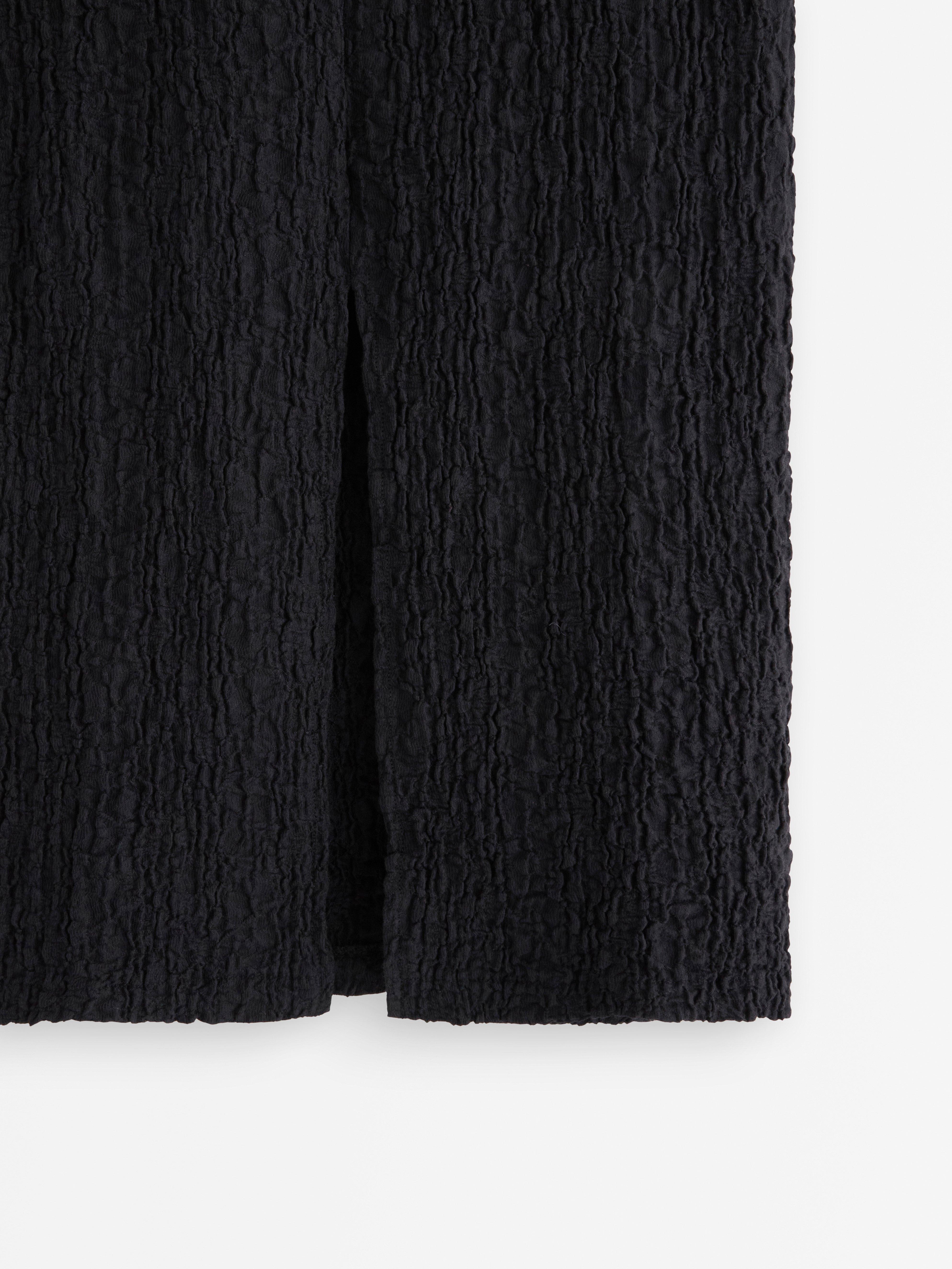 Falda midi de punto negra