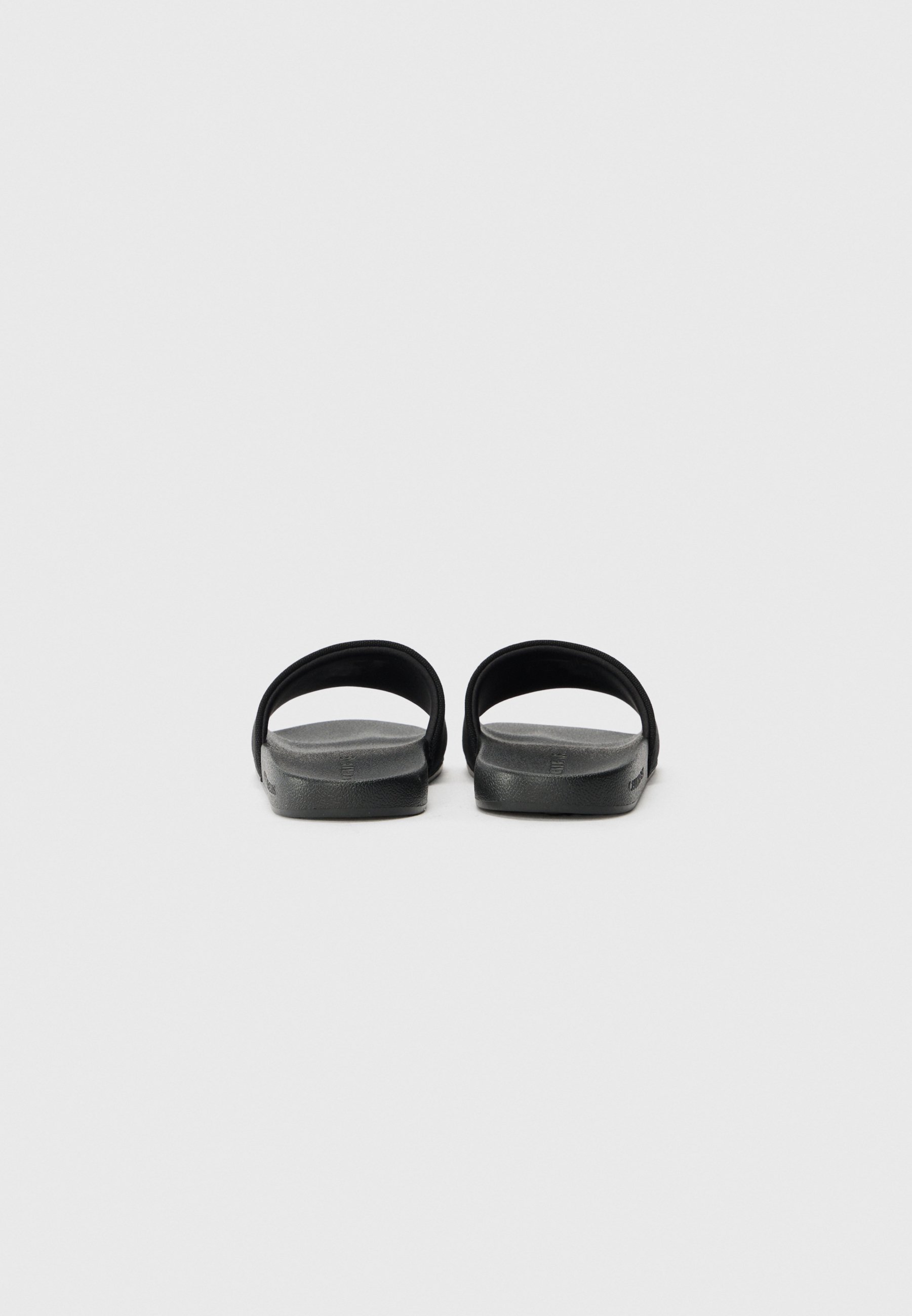 Calvin Klein Jeans SLIDE MONO - Nazouvací boty - black
