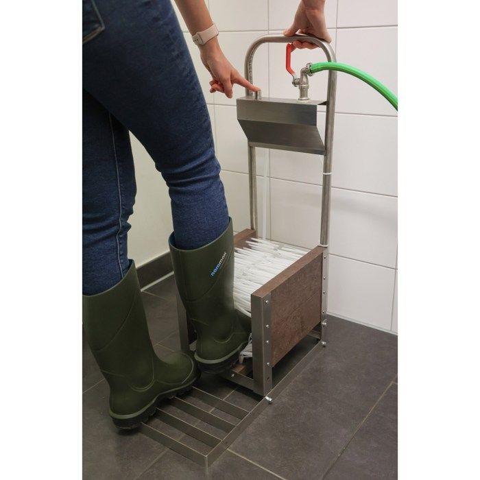 Kit de arandelas para botas desmontado en una caja Kerbl.