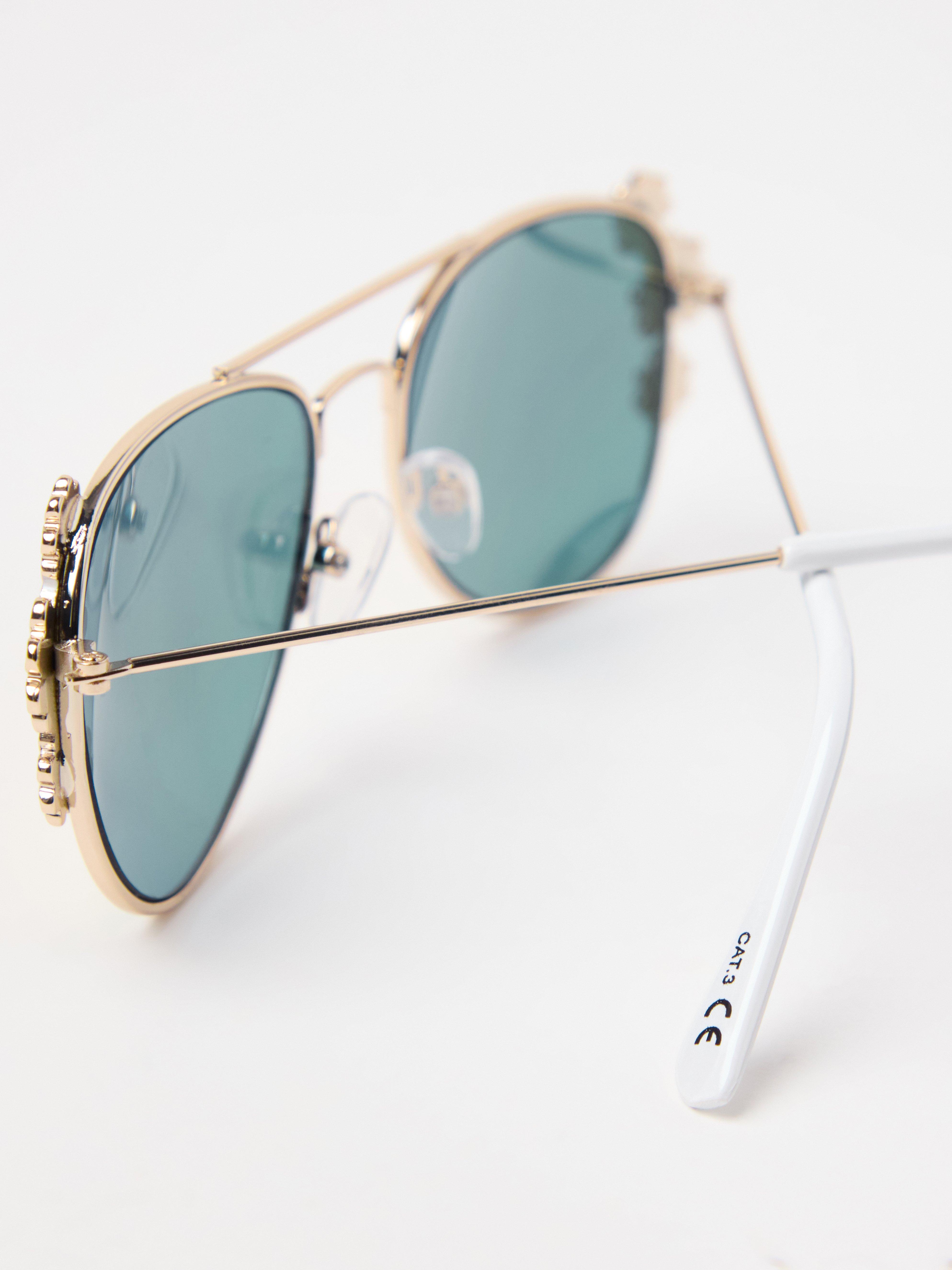 Gafas de sol doradas