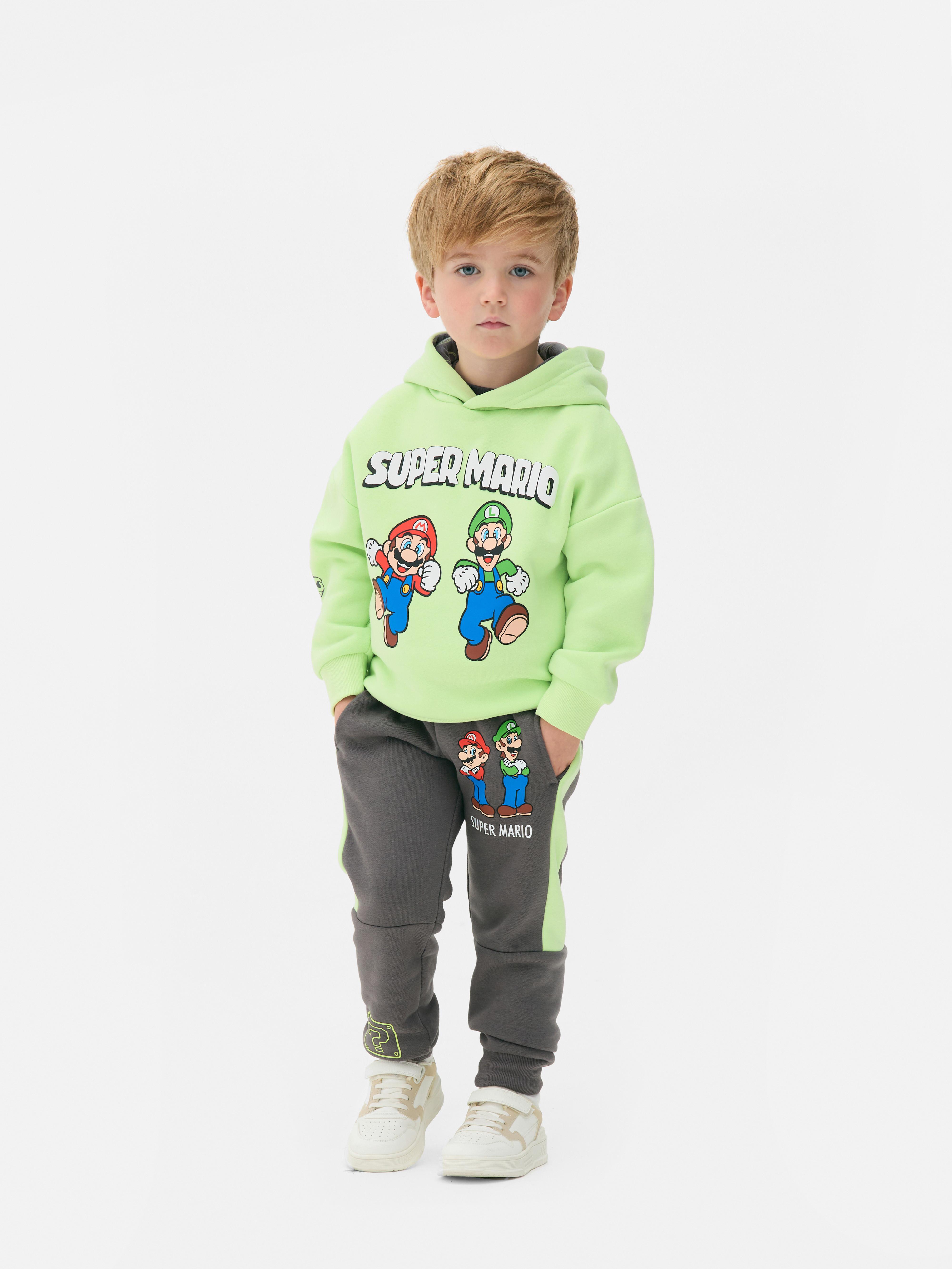 Passender Super Mario Hoodie Ein Hoodie mit überschnittenen Schultern, gerippten Bündchen und Super Mario-Prints