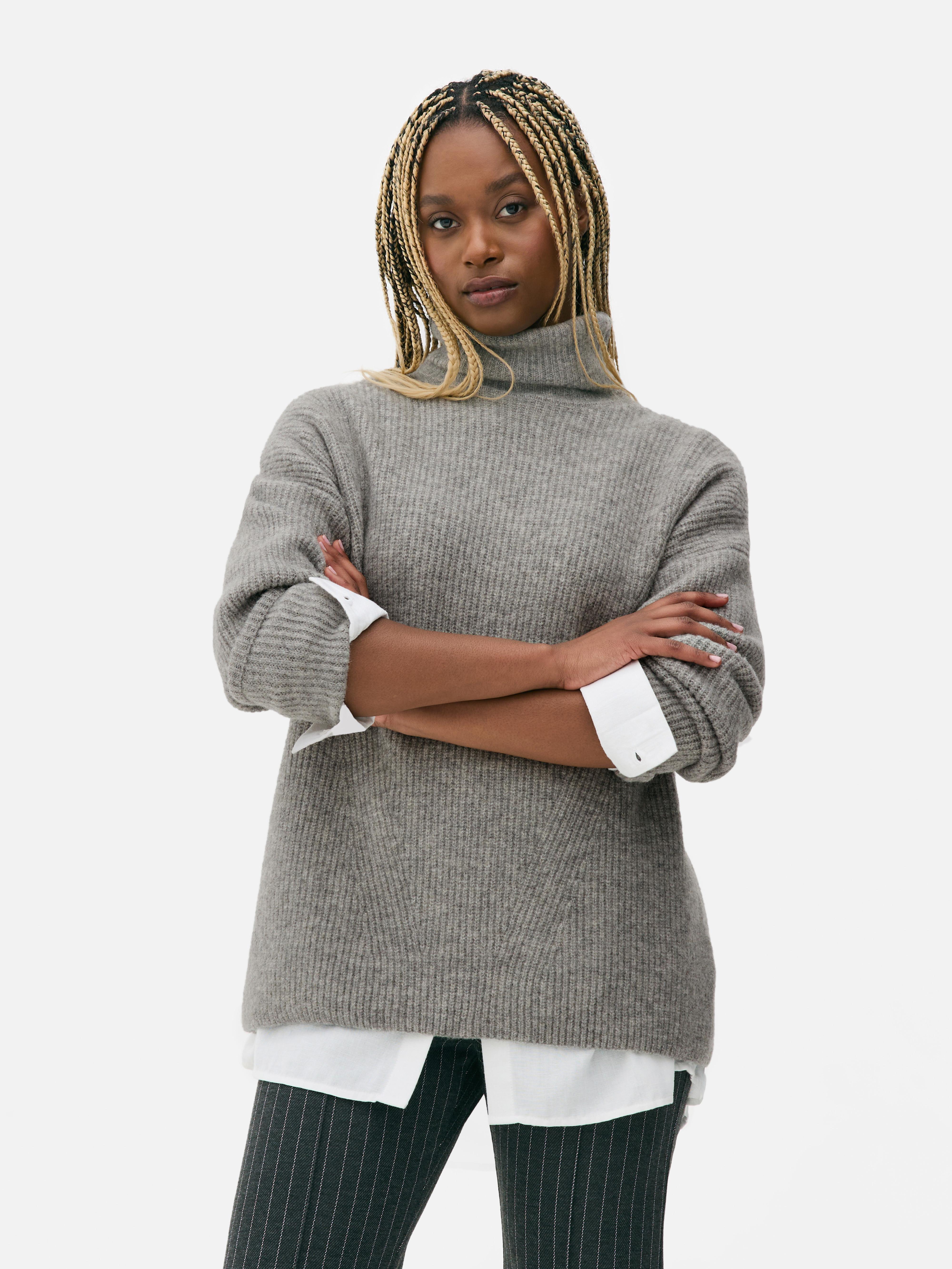 Αυτό το oversized ζιβάγκο με ριμπ ύφανση έχει χαμηλωμένα μανίκια
