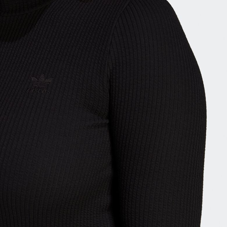 Cropped top met lange mouwen en ribstof, ideaal voor de winter.