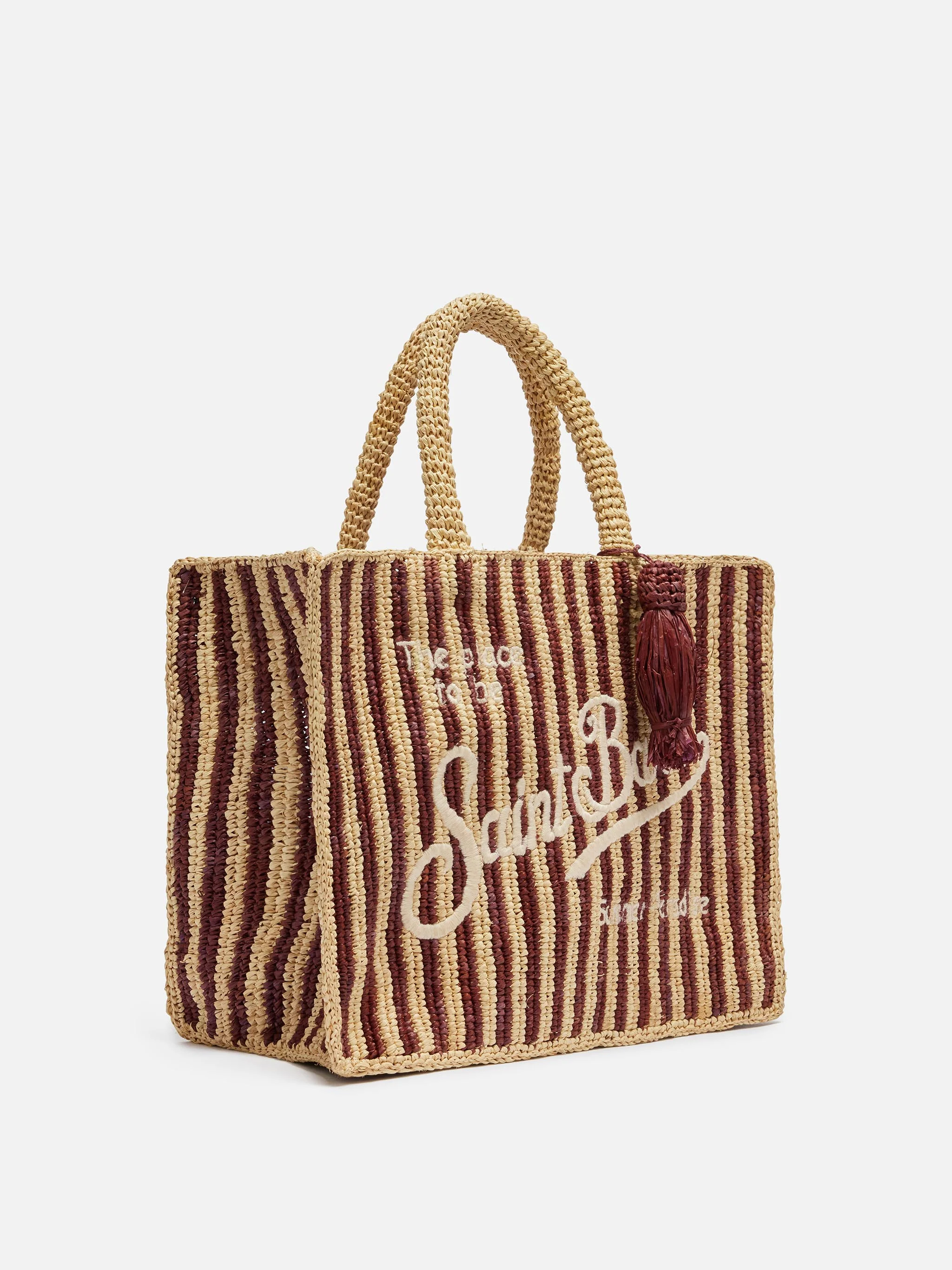 Colette tas van bruin gestreept raffia met geborduurd logo.