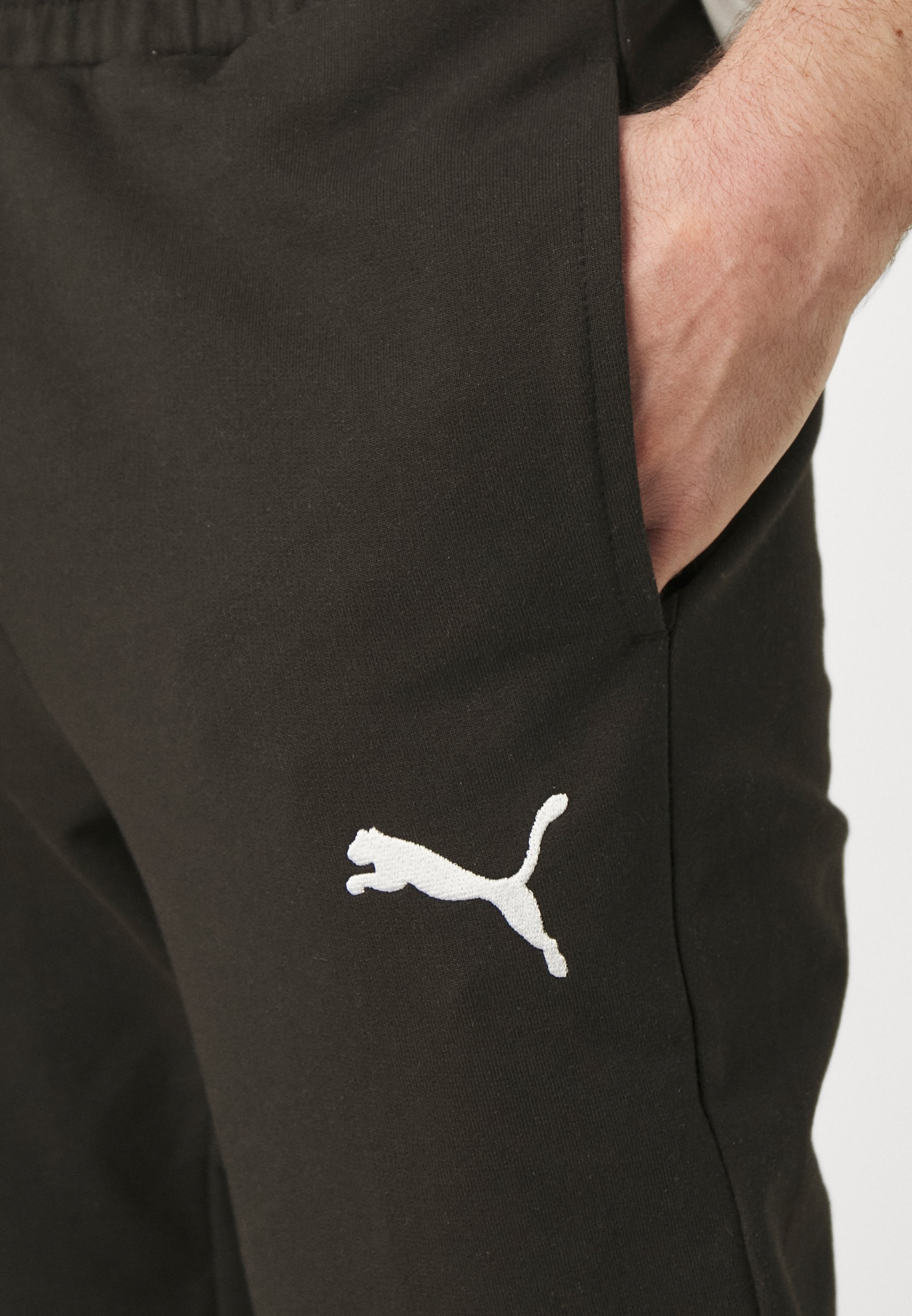 Puma TEAMGOAL CASUALS PANTS - Teplákové nohavice - čierna/biela