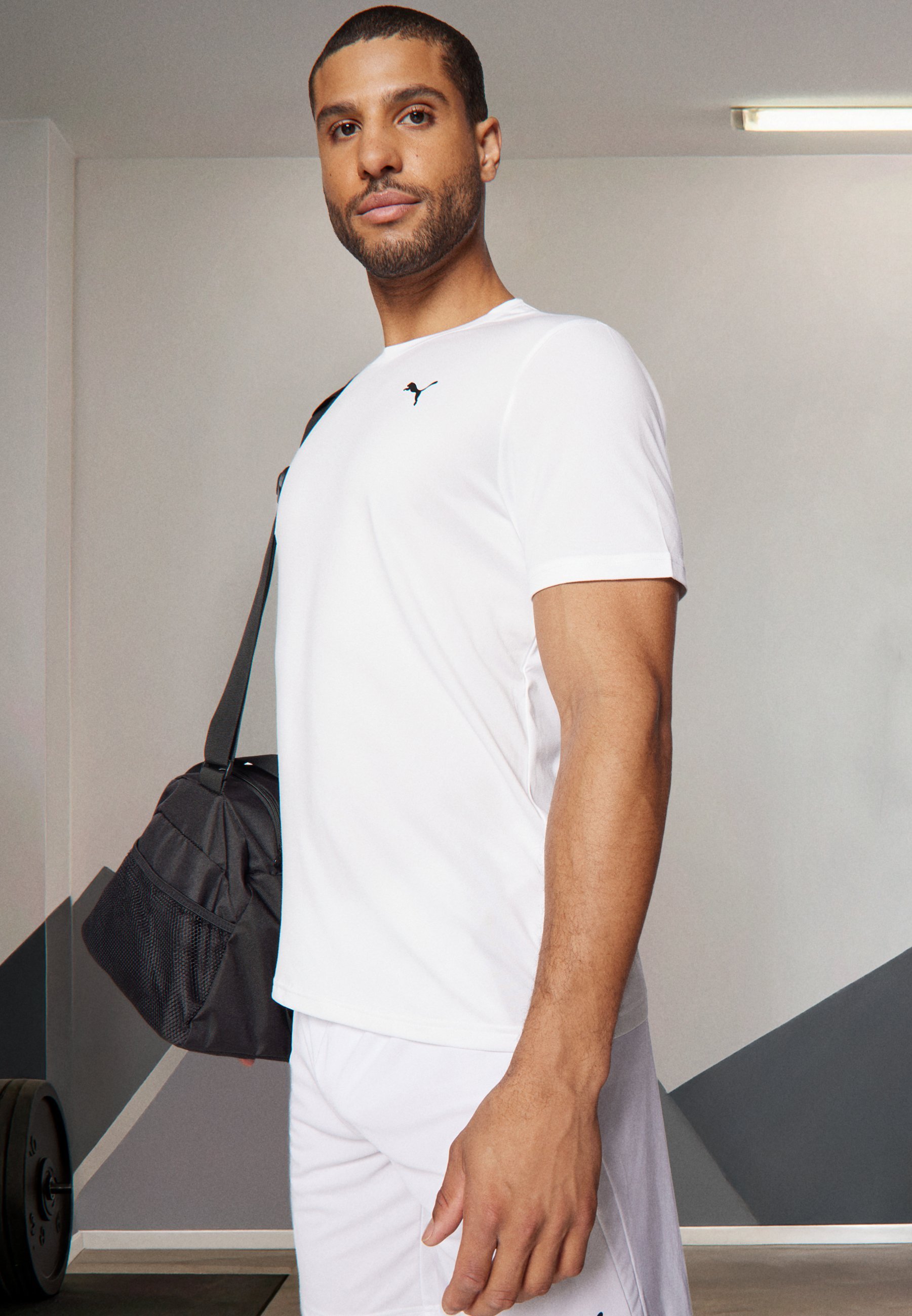 Puma ESSENTIALS SOLID CAT TEE - Sportovní tričko - white