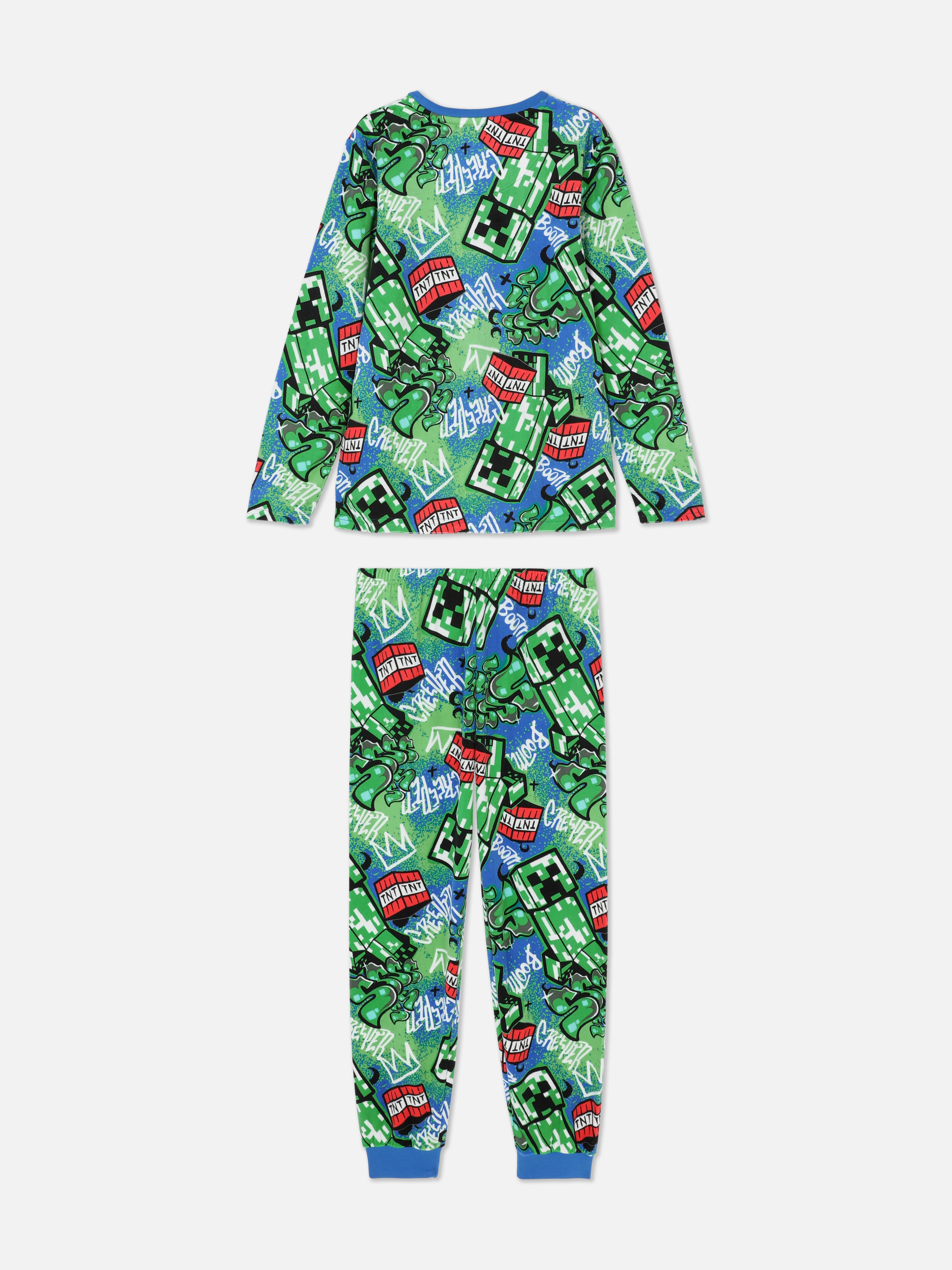 Set de pijamale Minecraft cu tricou și pantaloni. Acest set de pijamale, format dintr-un tricou și pantaloni confortabili, are un imprimeu Minecraft cool.