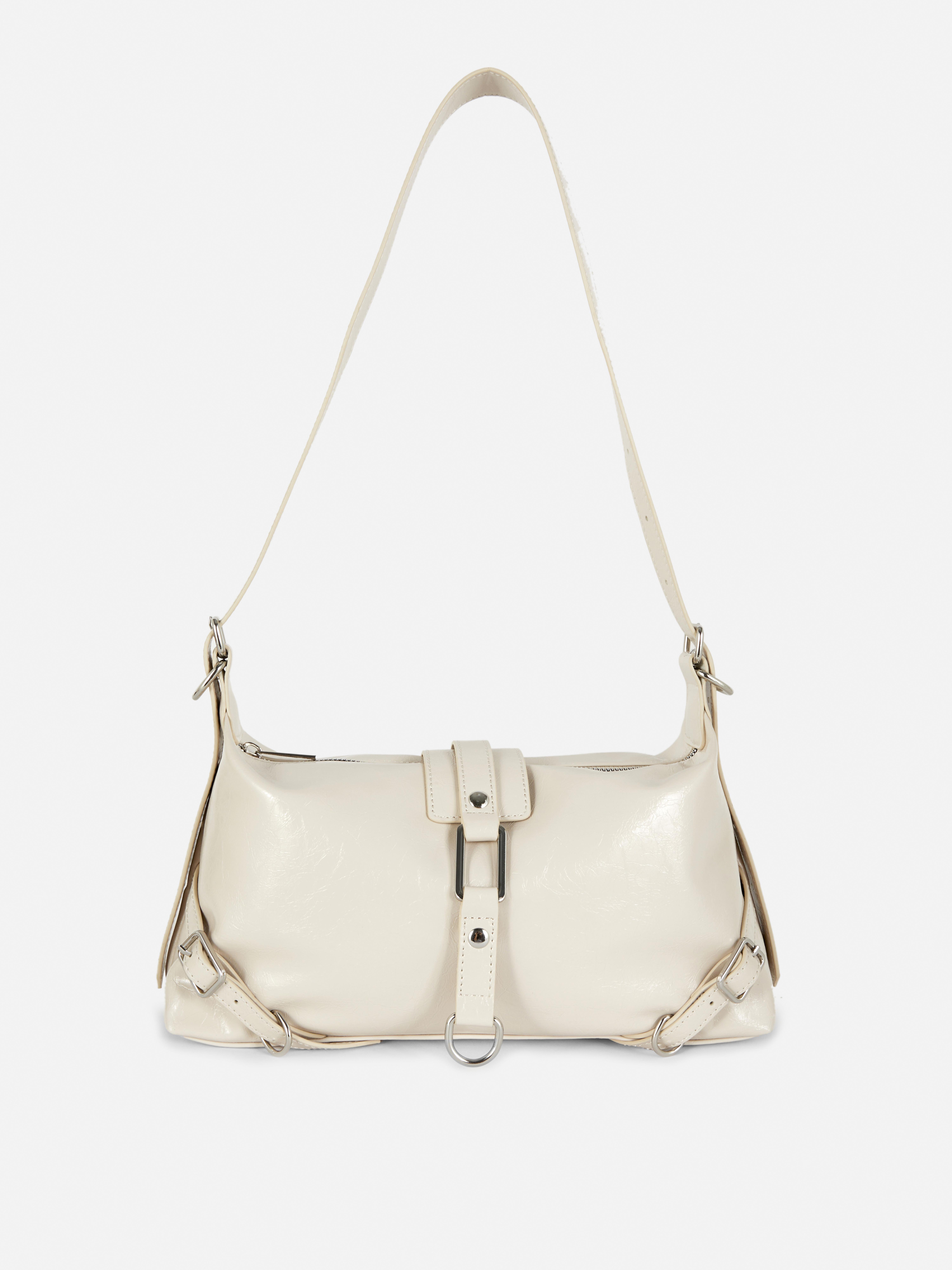 Schultertasche mit Riemendetails Eine auffällige Schultertasche mit einzigartigen Riemendetails