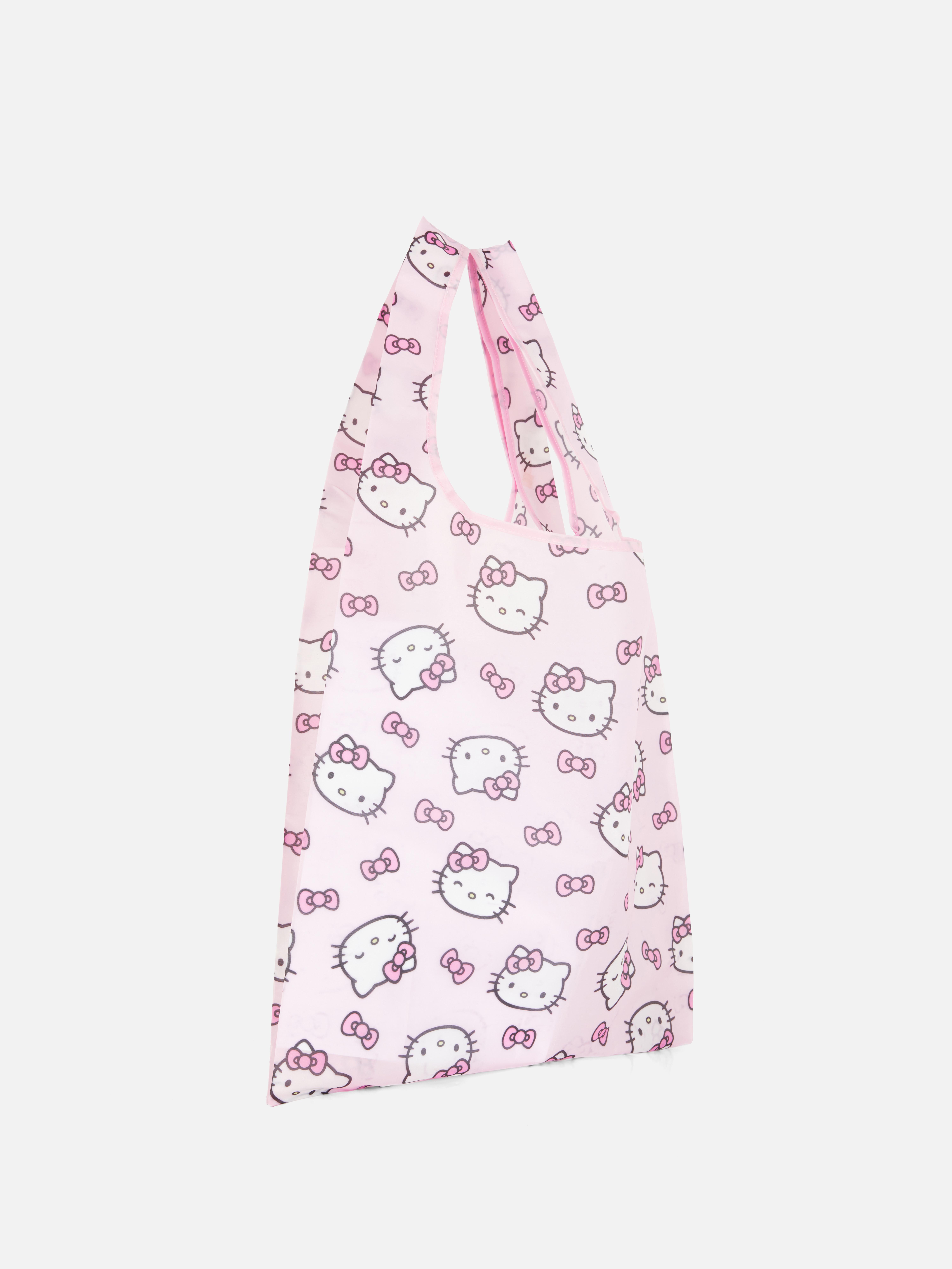 Geantă pliabilă Hello Kitty. O geantă drăguță cu model Hello Kitty, care poate fi pliată pentru depozitare ușoară.