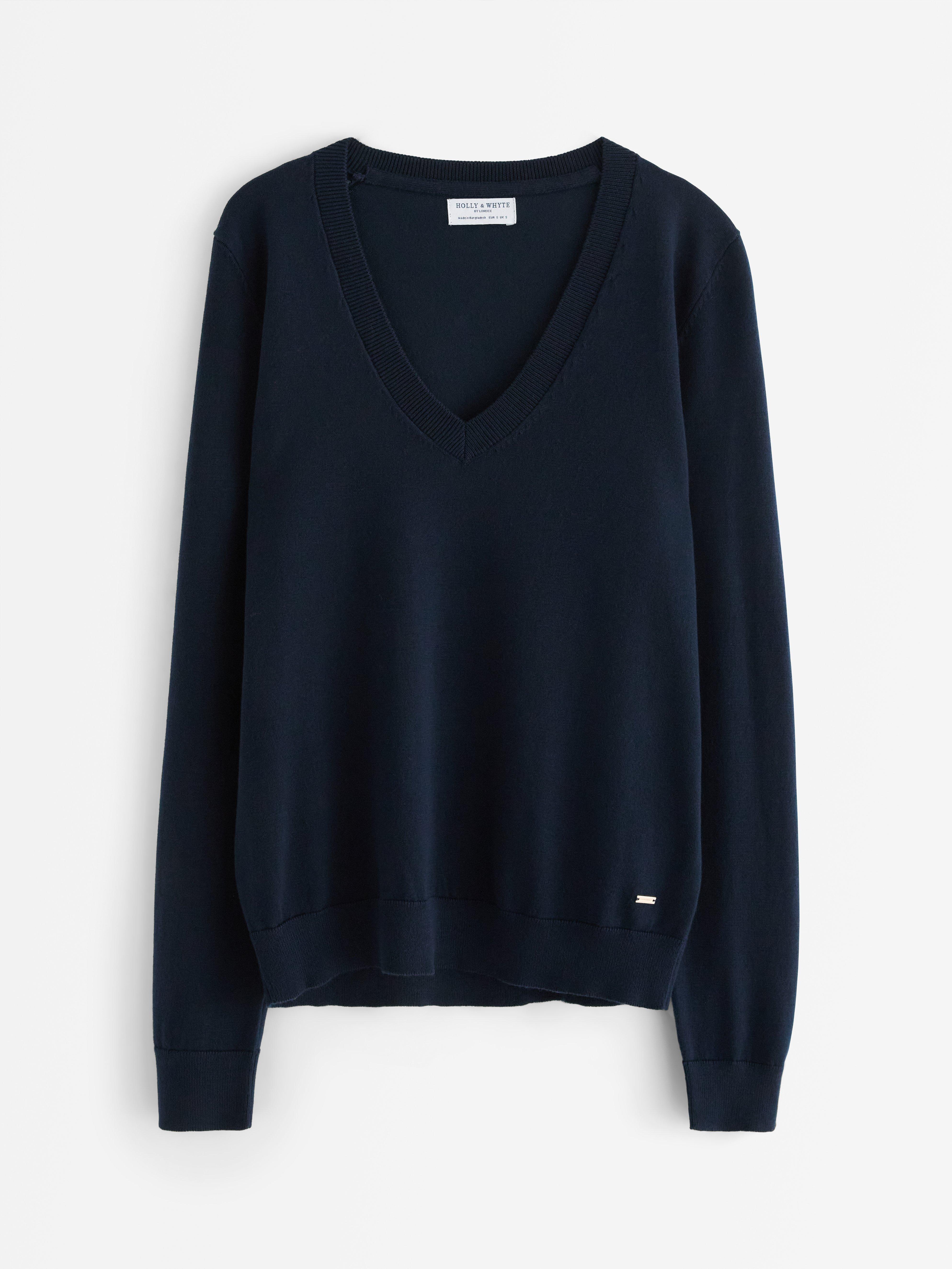 Jersey de punto fino con cuello en V, color azul marino.