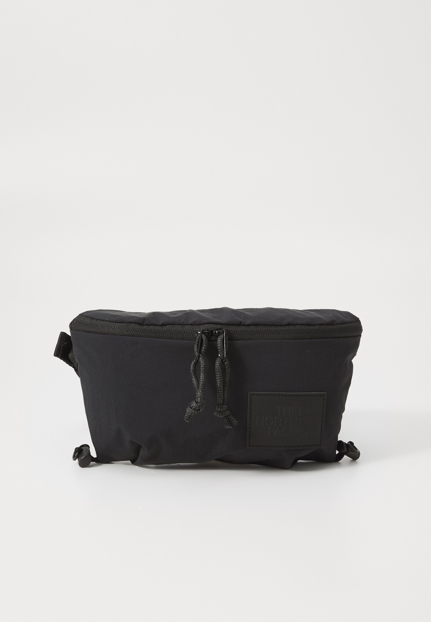 The North Face NEVER STOP LUMBAR UNISEX - Ľadvinka - tnf black