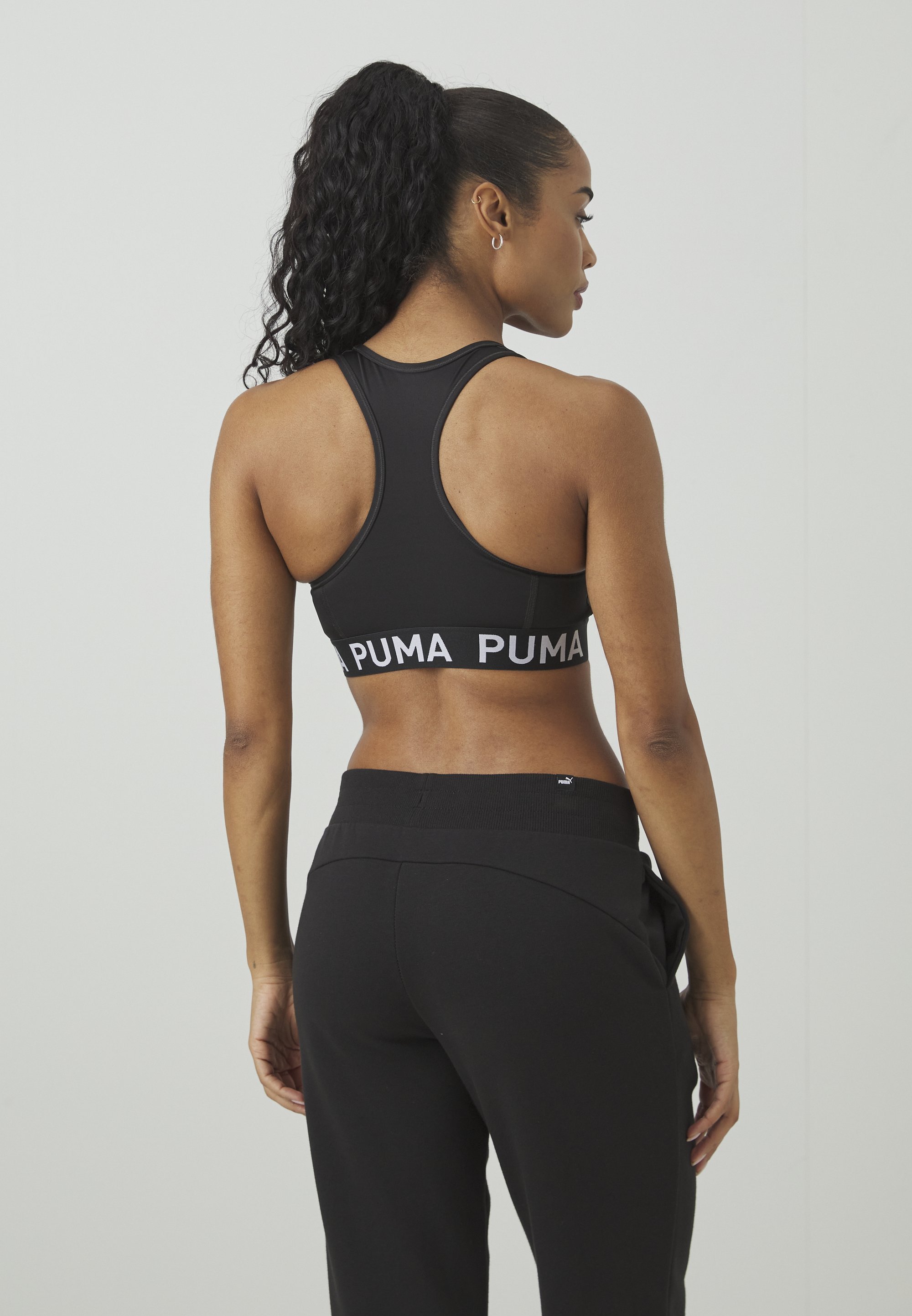 Puma KEEPS ELASTIC - Sportbeha met gemiddelde ondersteuning - zwart