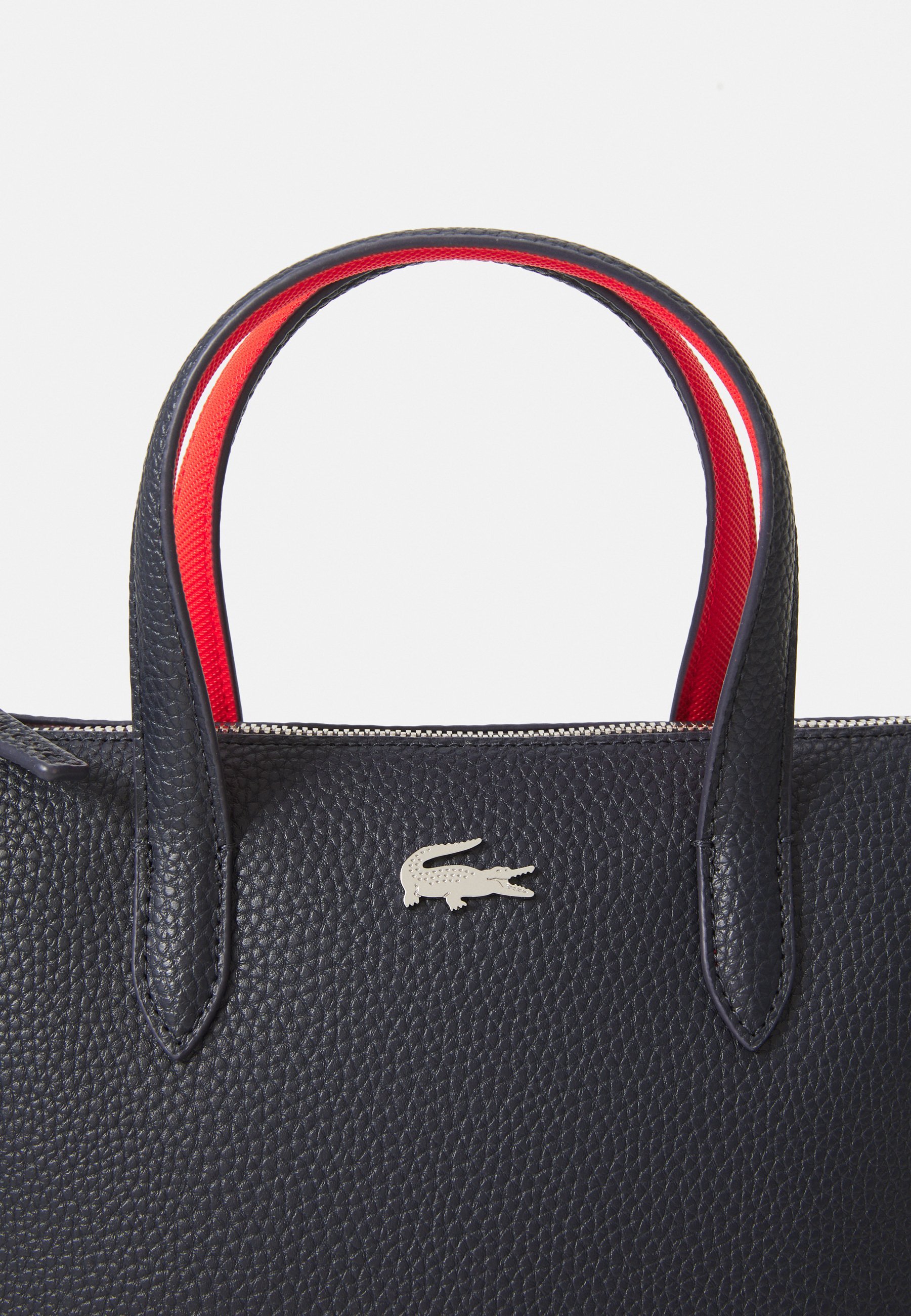 Lacoste rankinė - jūrų mėlyna/raudona