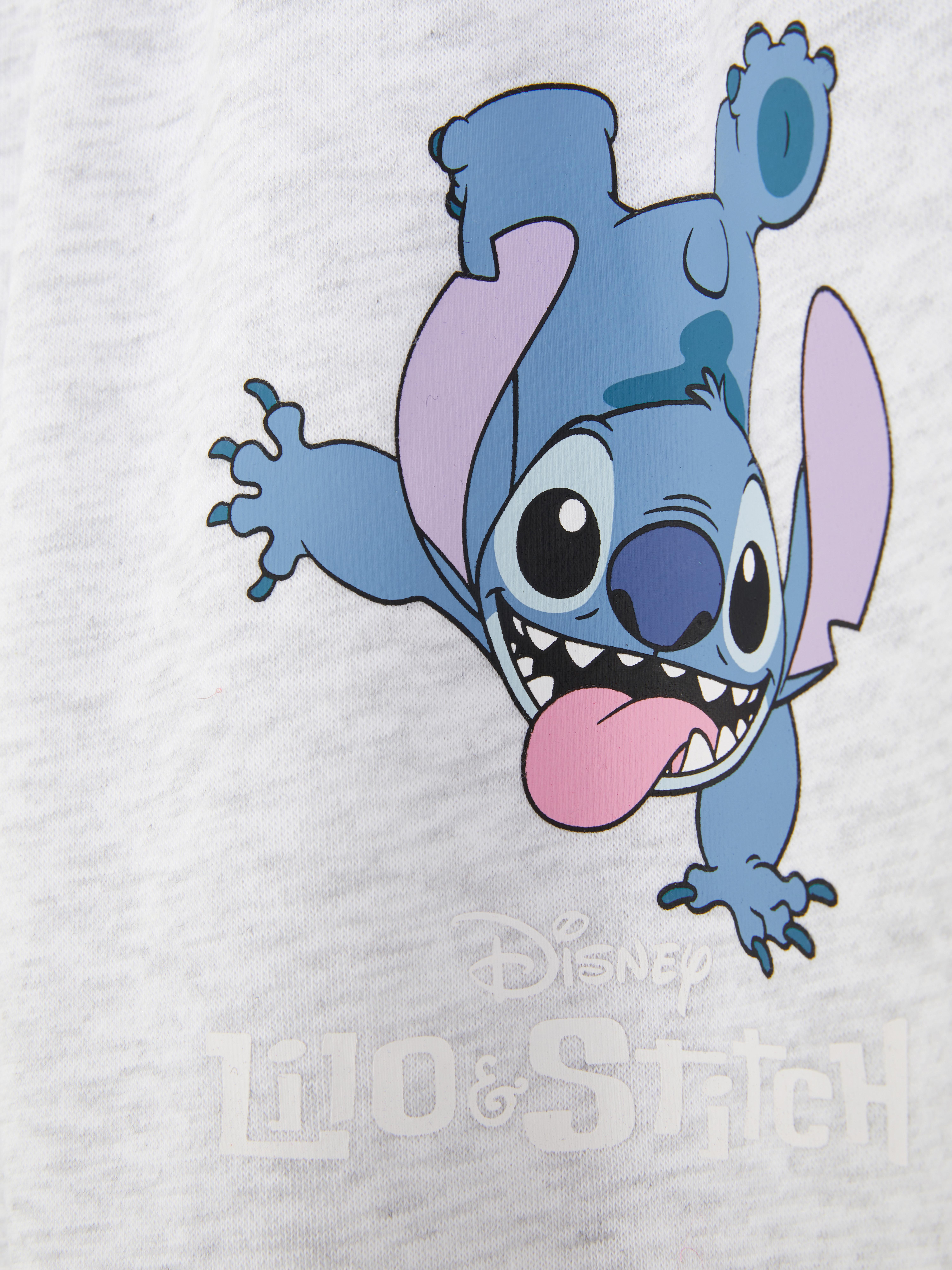 Pantaloni de trening cu șnur de fixare Disney's Stitch O pereche de pantaloni de trening cu șnur de fixare, manșete la gleznă și design Disney's Stitch