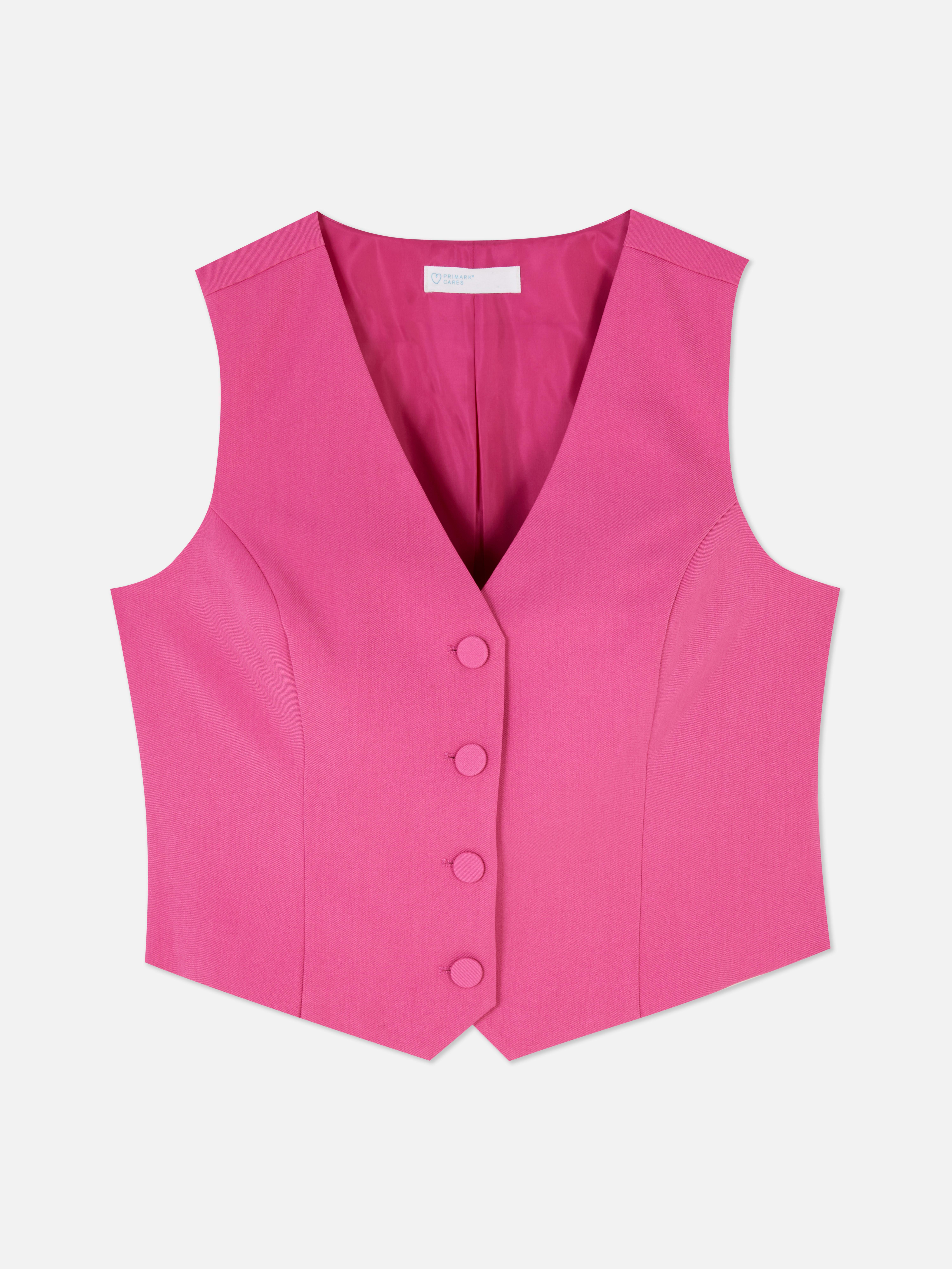 Vestă elegantă cu închidere cu nasturi. Această vestă atemporală, cu cusături prințesă, închidere cu nasturi și decolteu în V, este un adevărat must-have.