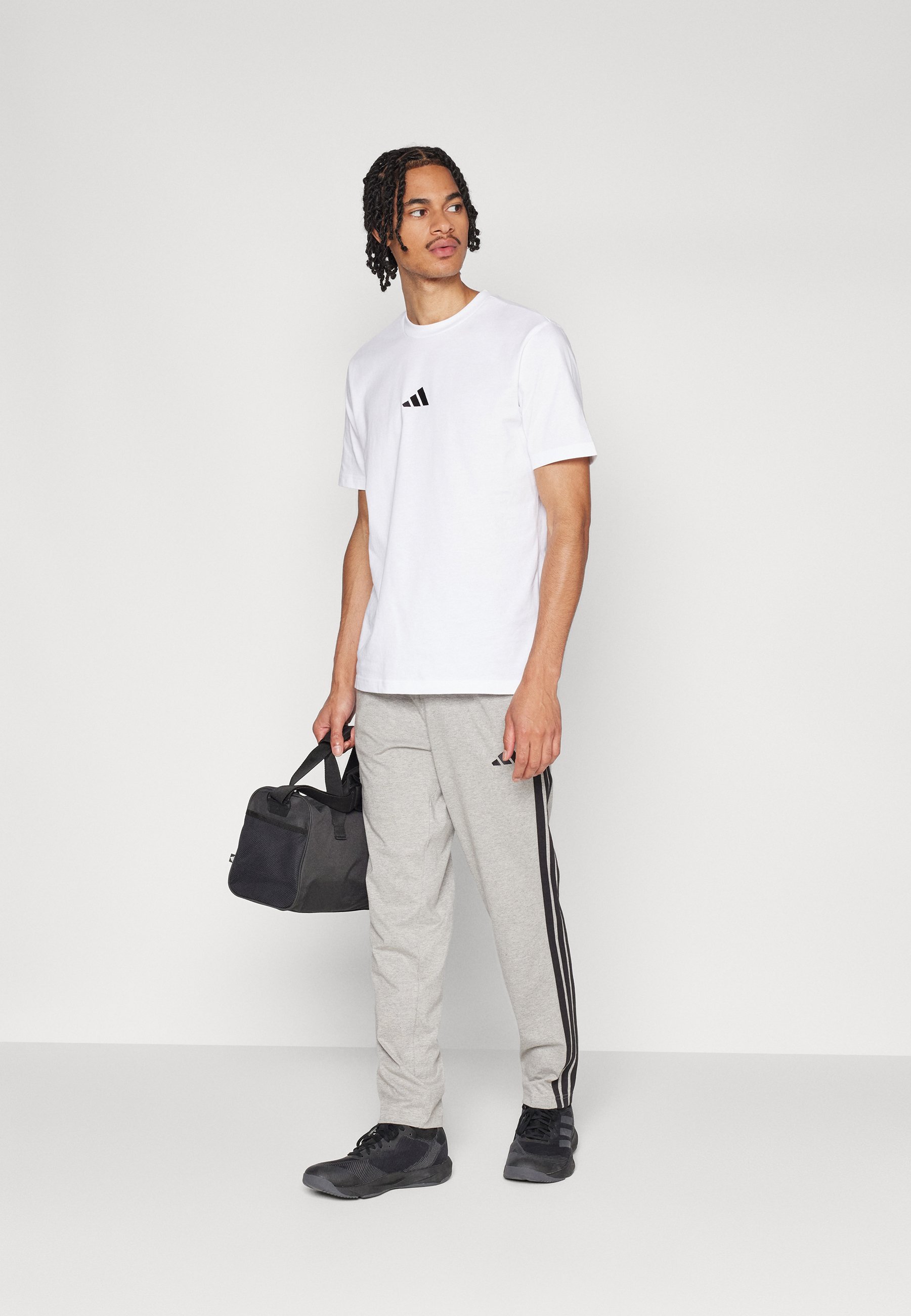 adidas Sportswear ESSENTIAL THREE STRIPES SINGLE - Trainingsbroek - middengrijs gemêleerd/zwart