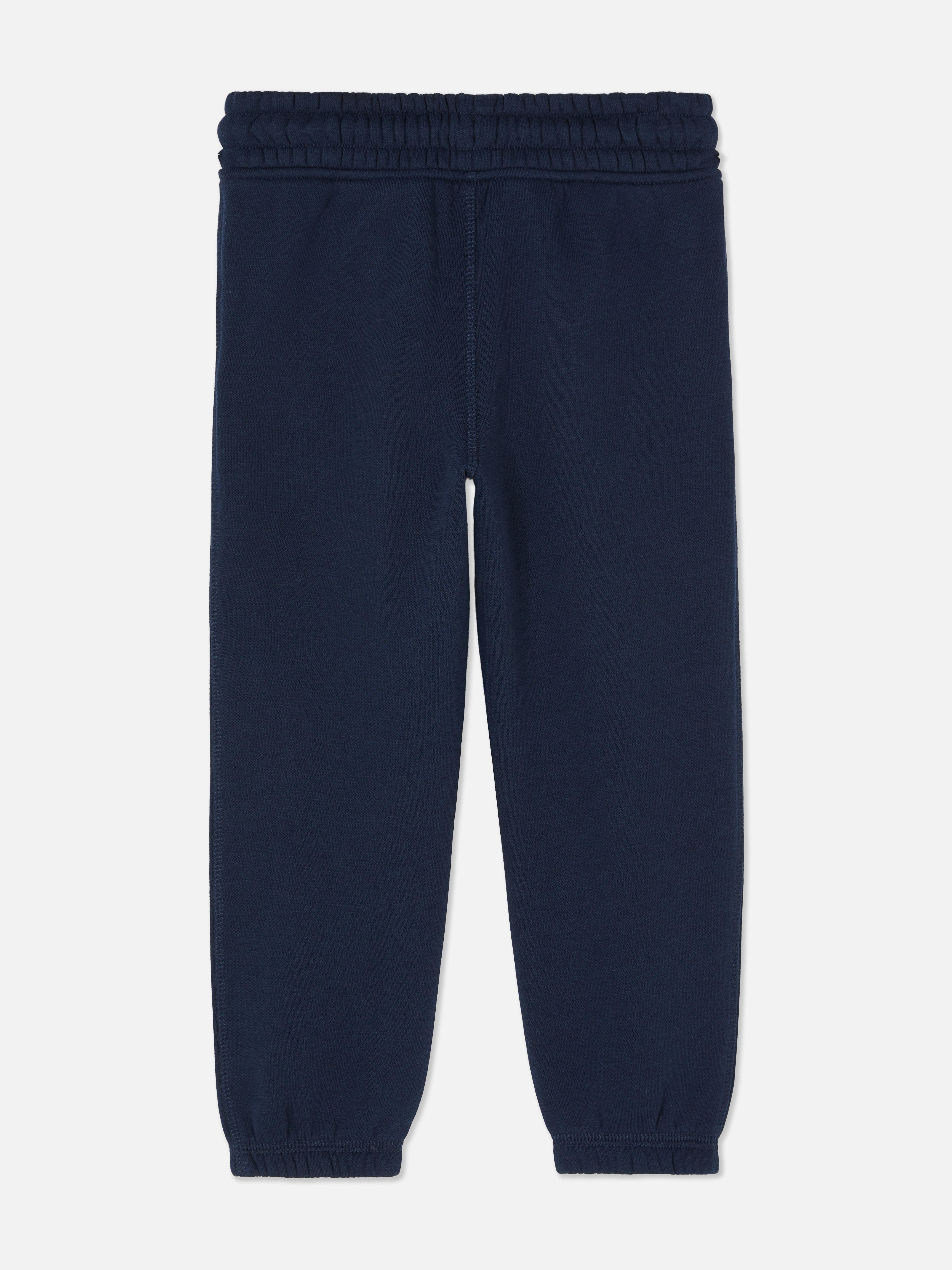 Jogginghose für Jungen mit Kordelzug und Bündchen. Vervollständigen Sie die Freizeitgarderobe Ihres Kindes mit dieser Jogginghose mit Kordelzug im Bund, Seitentaschen und Bündchen.