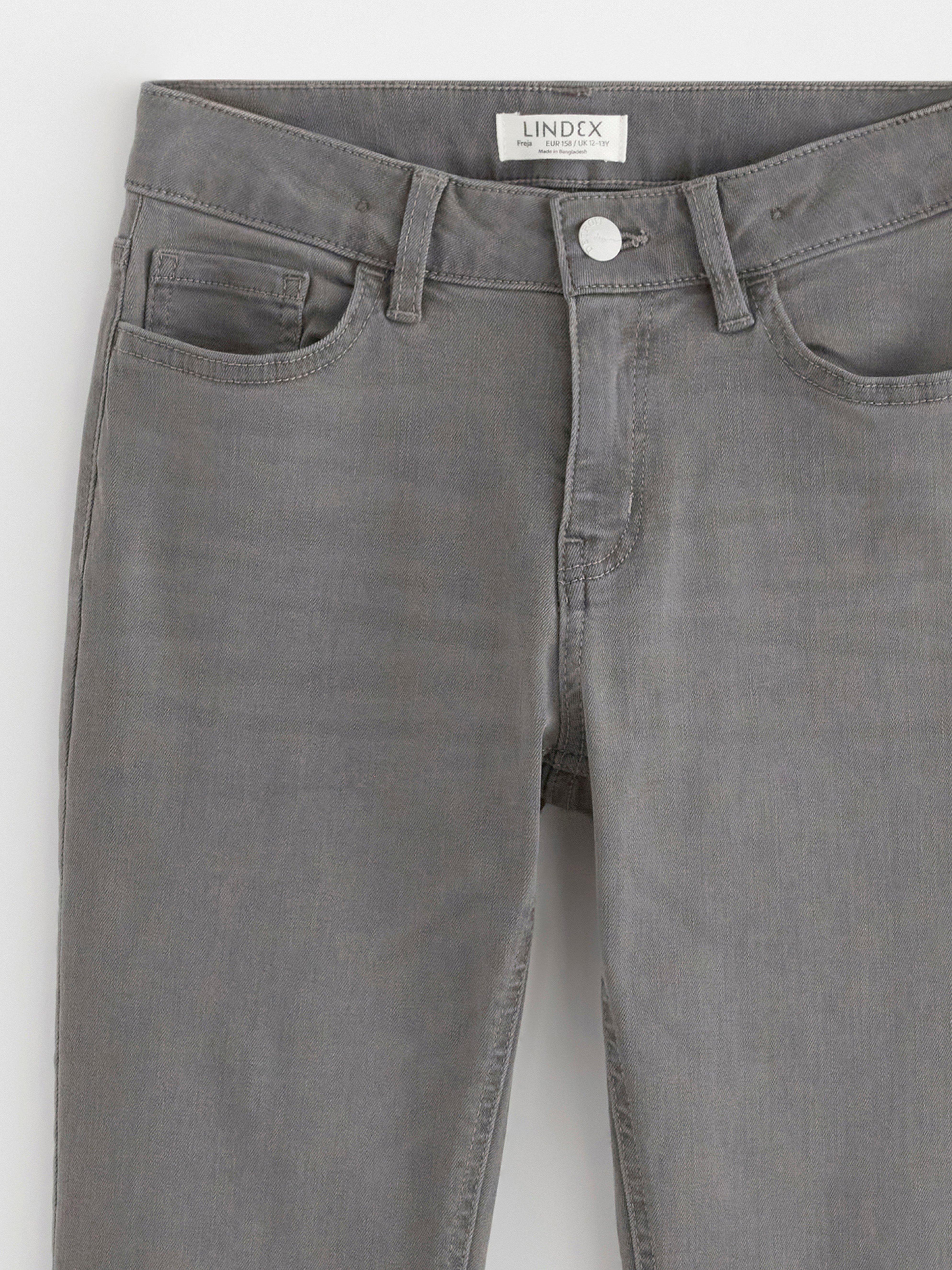 FREJA Jeans med utsving i benet Grå