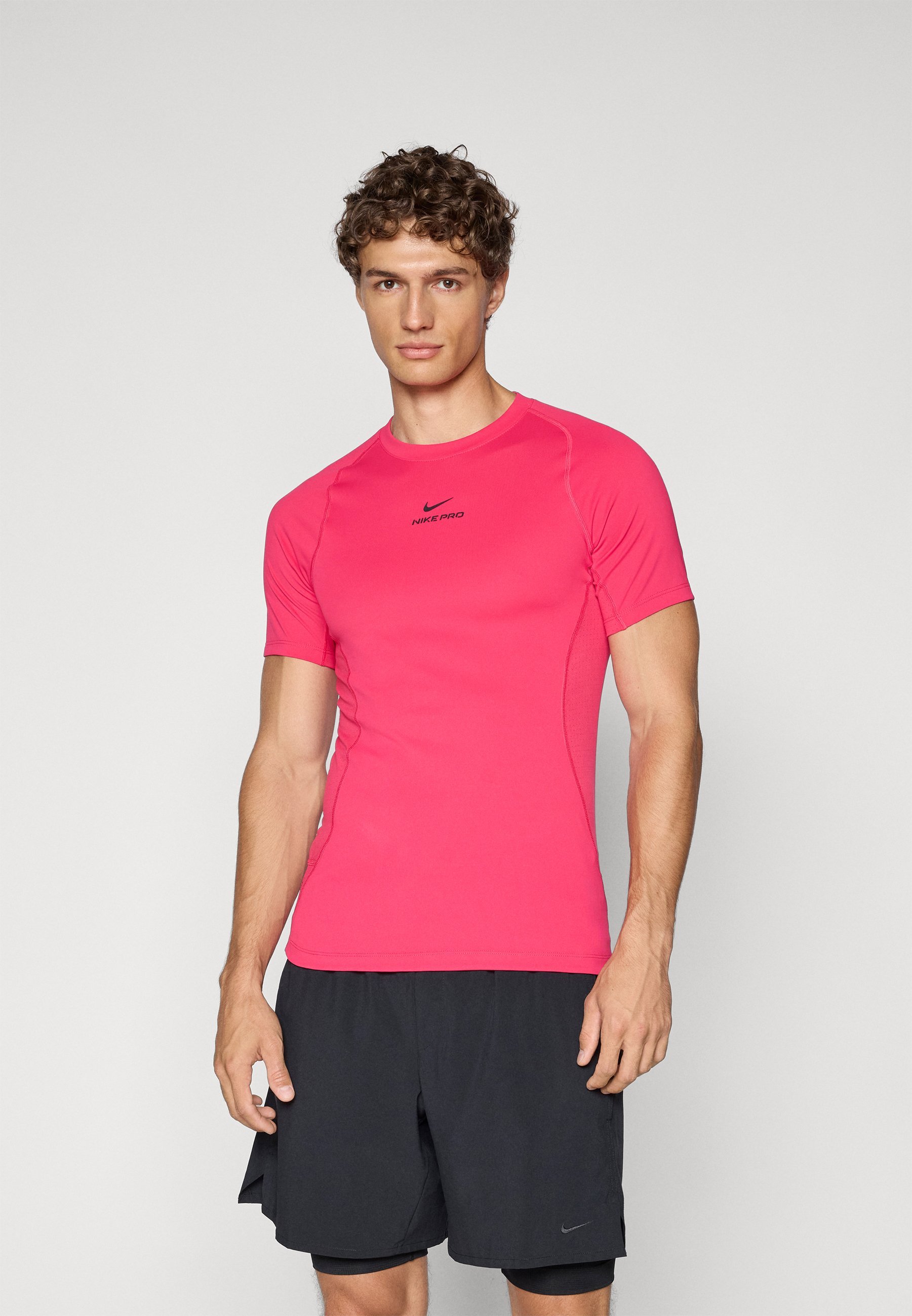 T-shirt de sport Nike Performance TOP - rose fuchsia/noir
