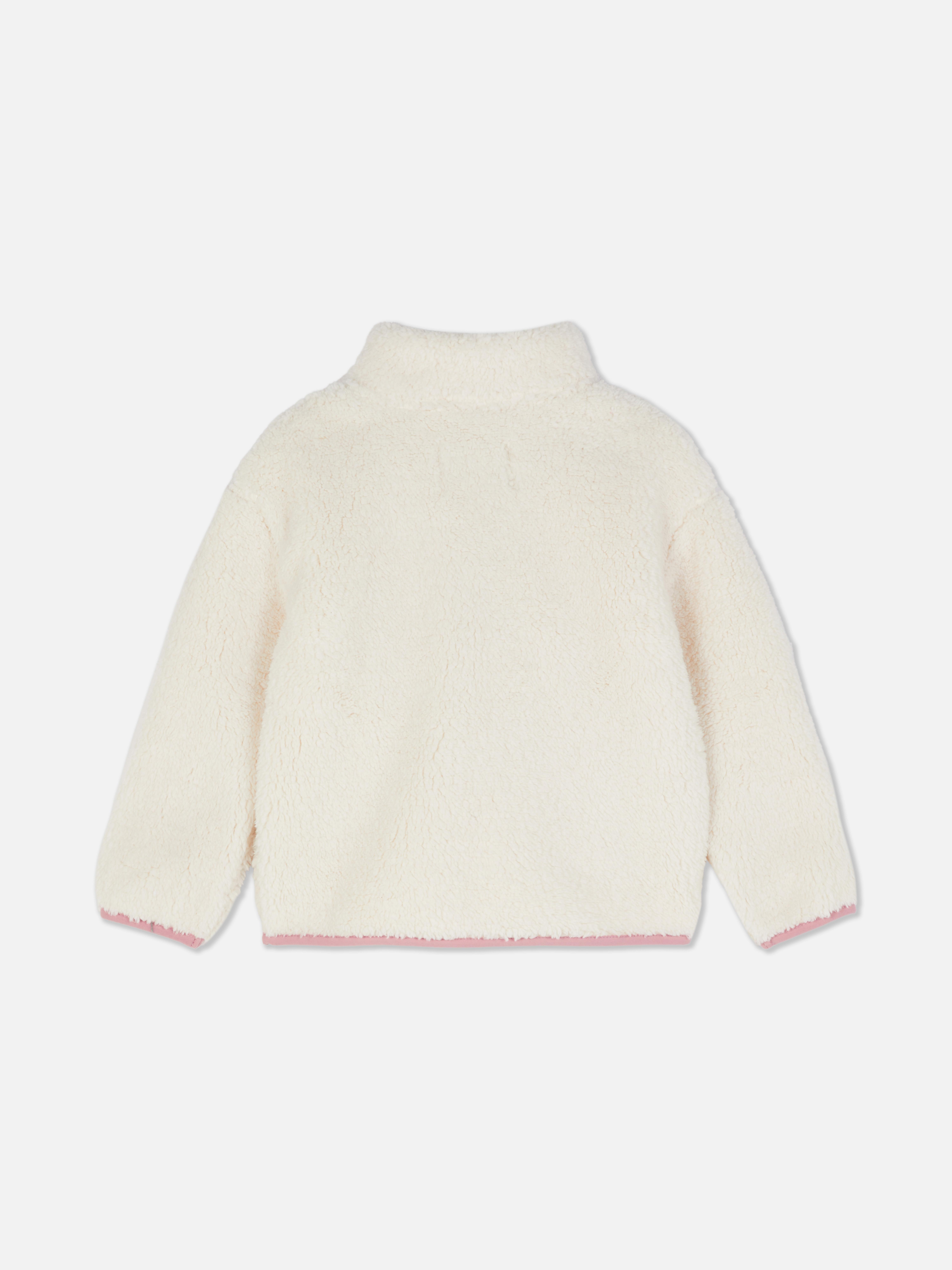 Hanorac din fleece Disney Minnie Mouse Un hanorac din fleece cu guler ridicat, fermoar, buzunar la piept și garnitură contrastantă