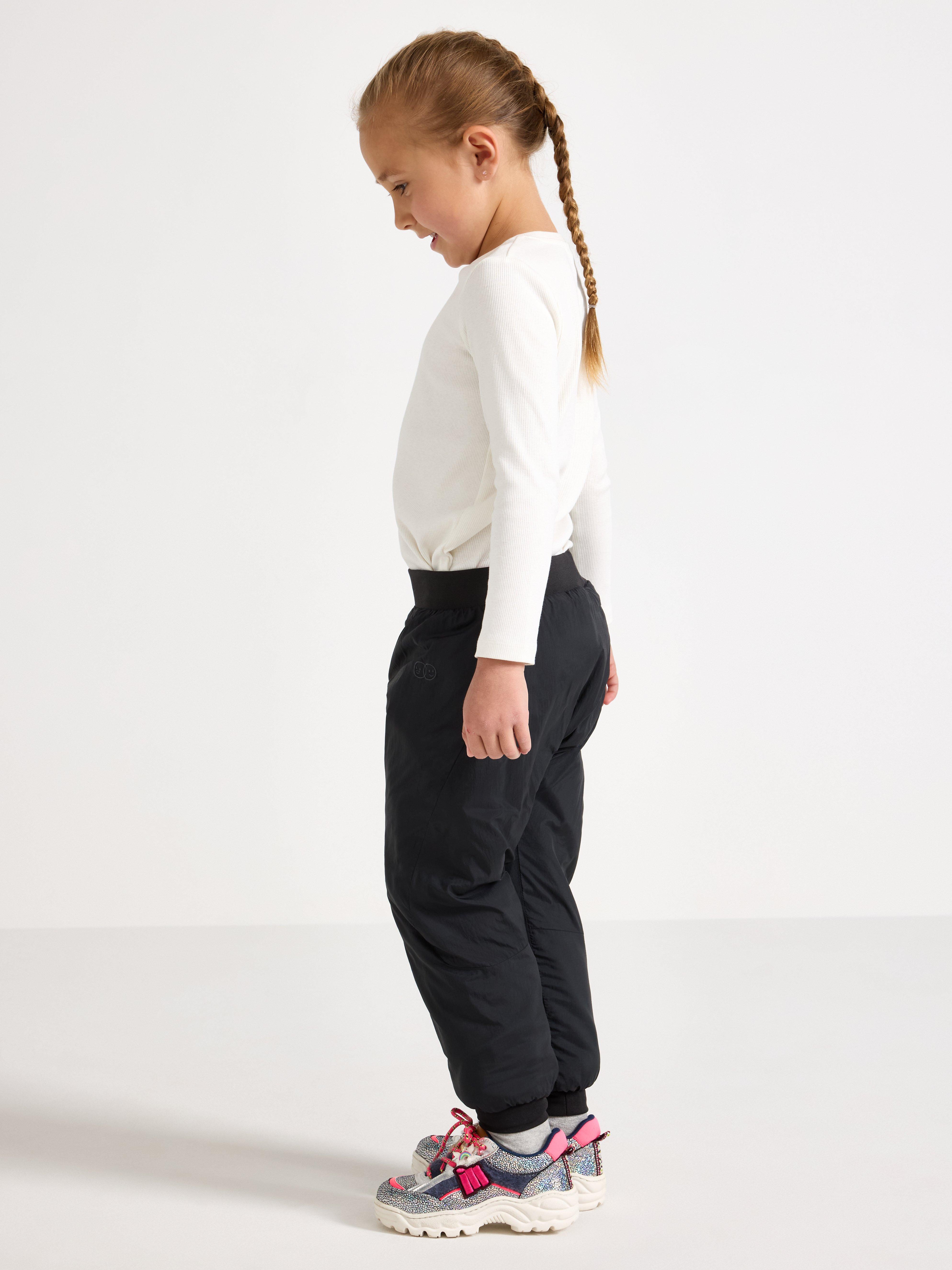 Pantalones ligeros, acolchados e impermeables – Ropa deportiva infantil negra