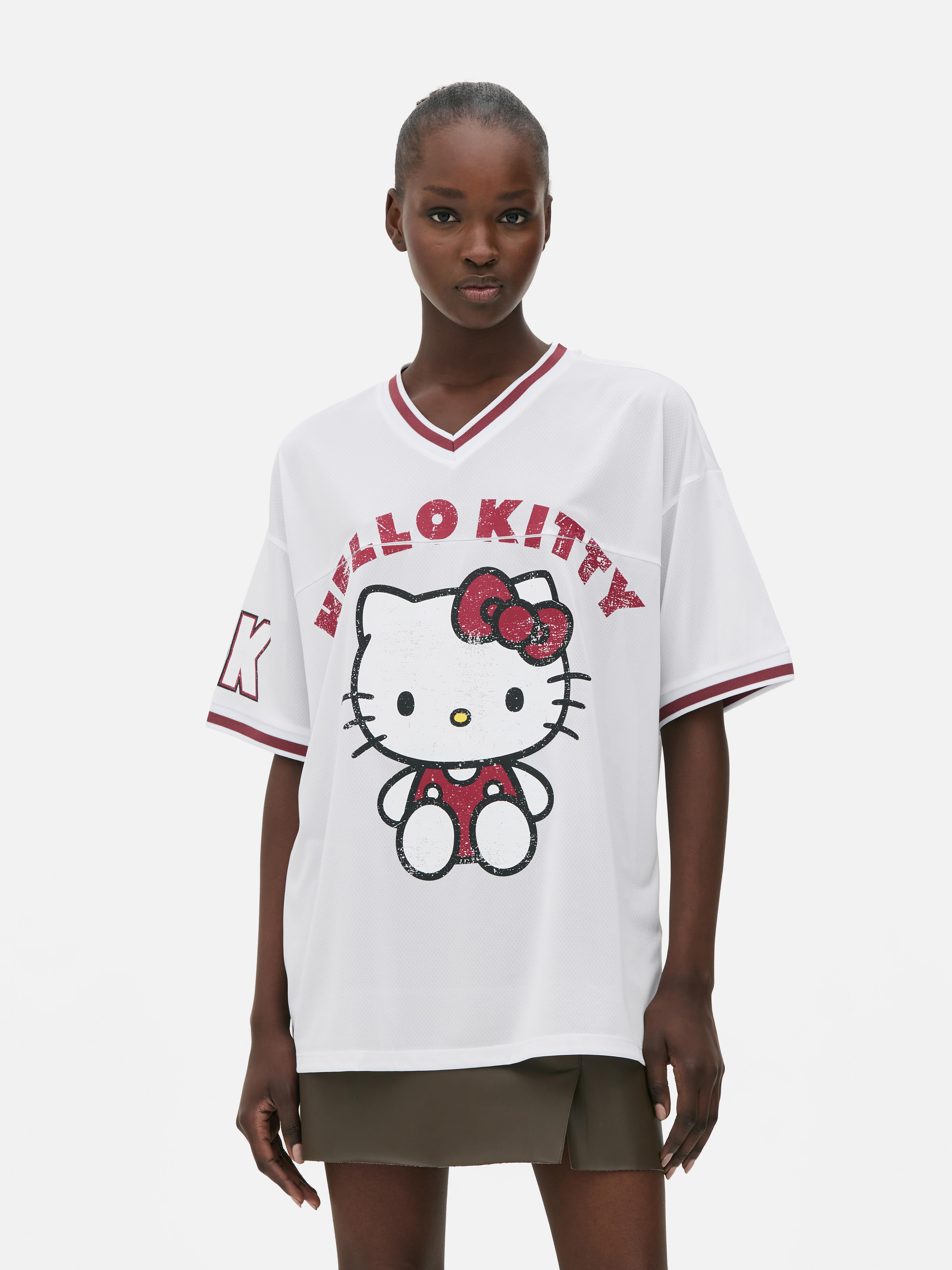 Tricou de fotbal Hello Kitty Un tricou de fotbal cu decolteu în V, mâneci scurte și imprimeu Hello Kitty