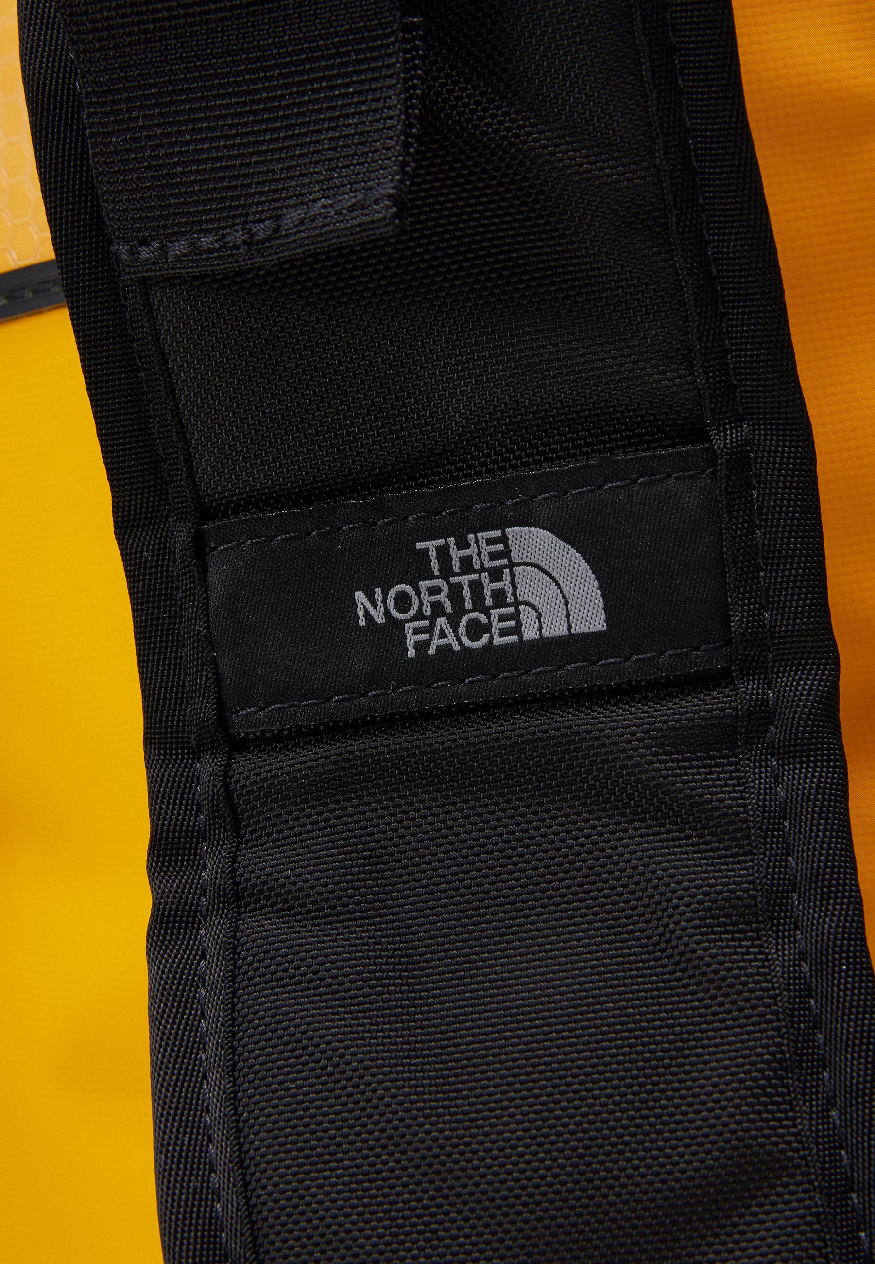 Borsa da viaggio The North Face BASE CAMP DUFFEL - XS - Borsone - oro Summit/nero